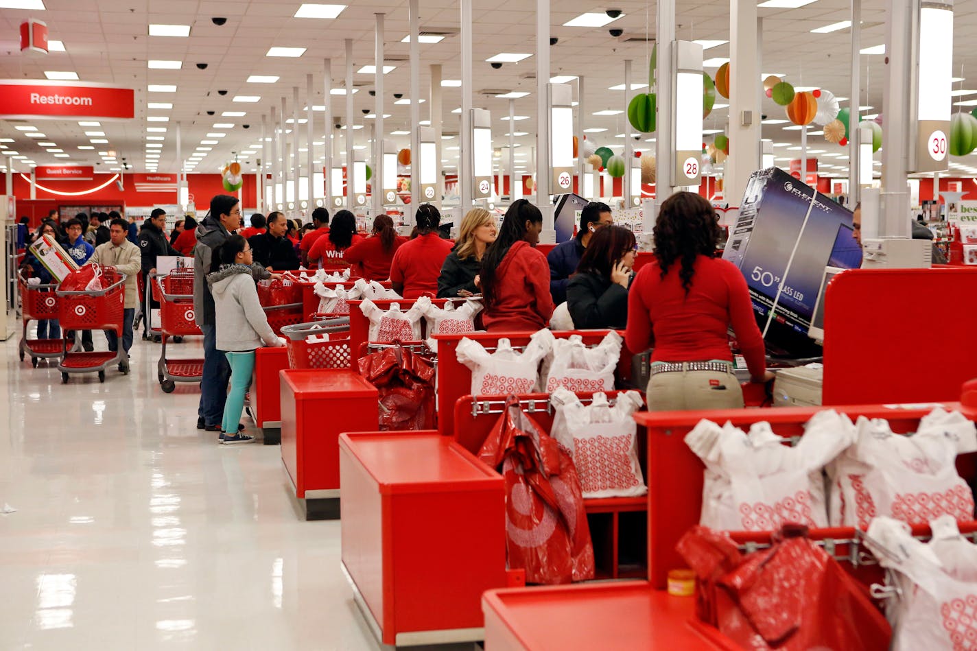 Customers purchase merchandise at a Target Corp. store in Chicago.