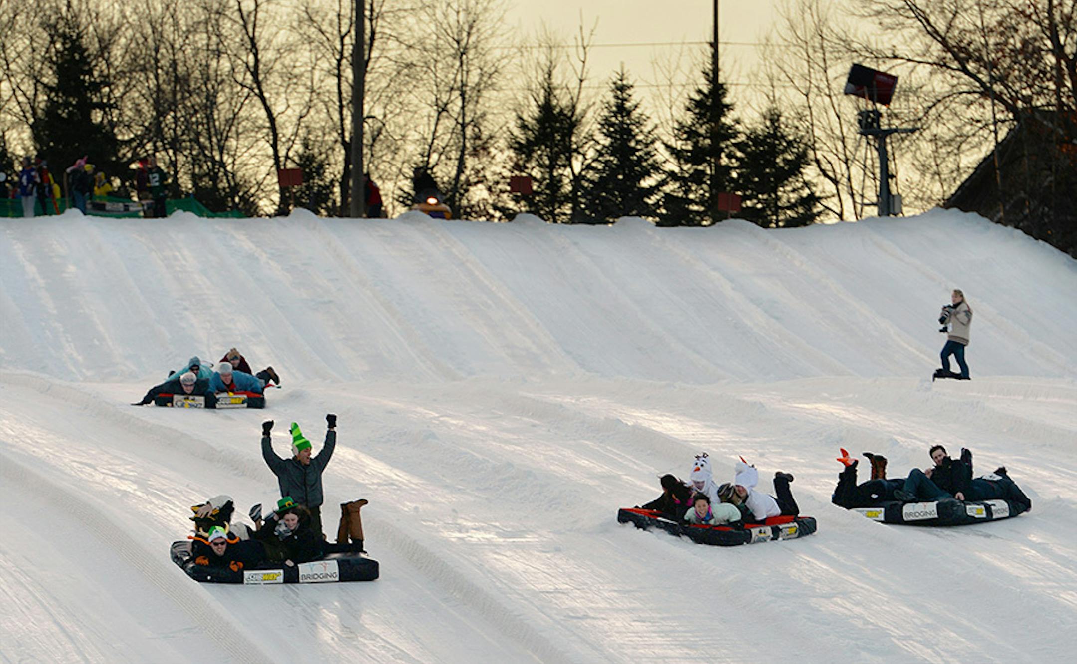 Teams of four race down Buck Hill's tubing lanes atop mattresses while in a bracket-style competition to raise money for Bridging, the largest non-profit furniture bank in North America. ] (SPECIAL TO THE STAR TRIBUNE/BRE McGEE) **Bedrace for Bridging