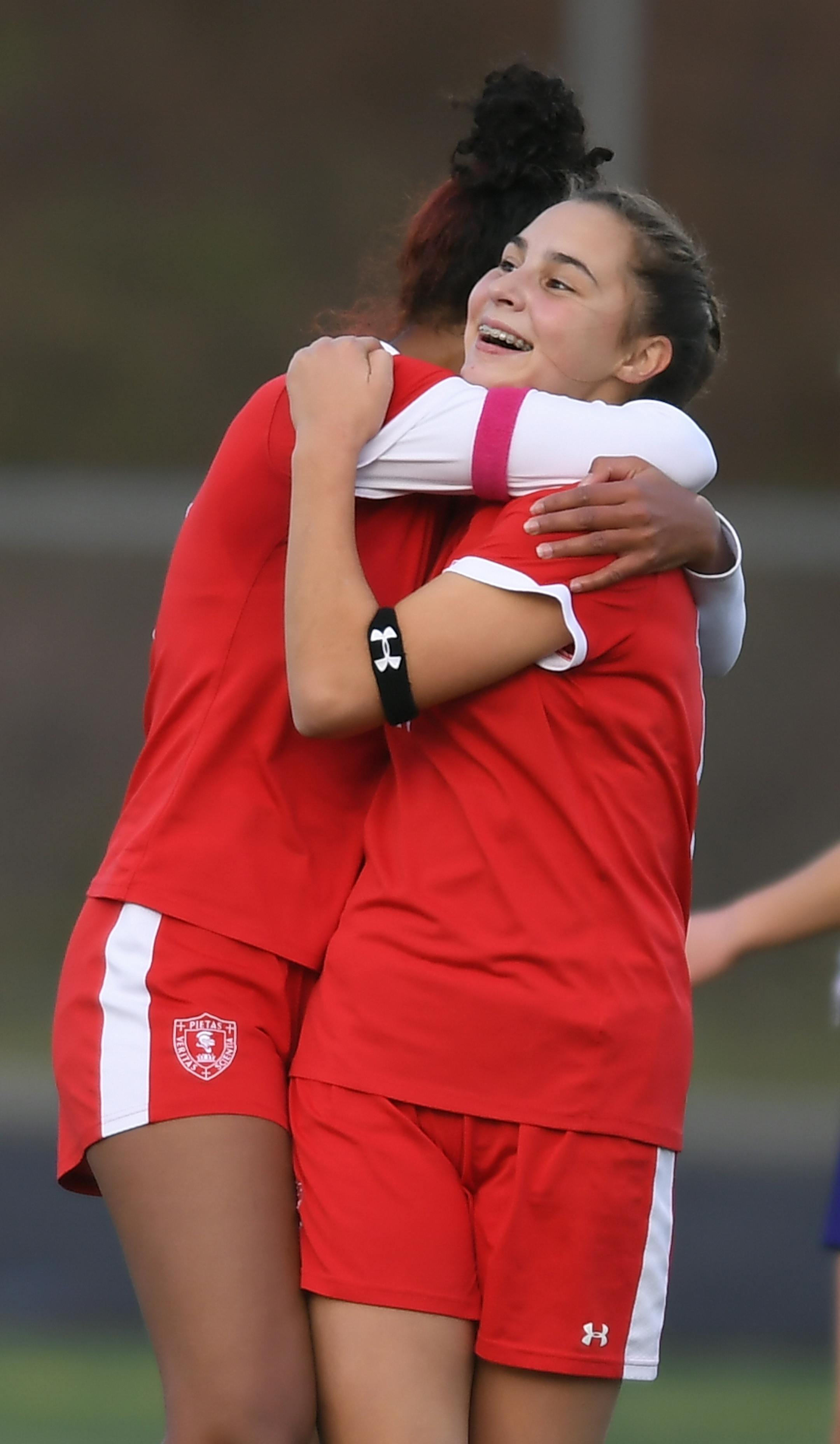 Teammates celebrated with Benilde-St. Margaret's forward Elizabeth Dietzen (19) after her goal in the first half against Rochester Lourdes. ] Aaron Lavinsky • aaron.lavinsky@startribune.com Benilde-St. Margaret's played Rochester Lourdes in a Class 1A girls' quarterfinal game on Wednesday, Oct. 24, 2018 at Prior Lake High School in Savage, Minn.