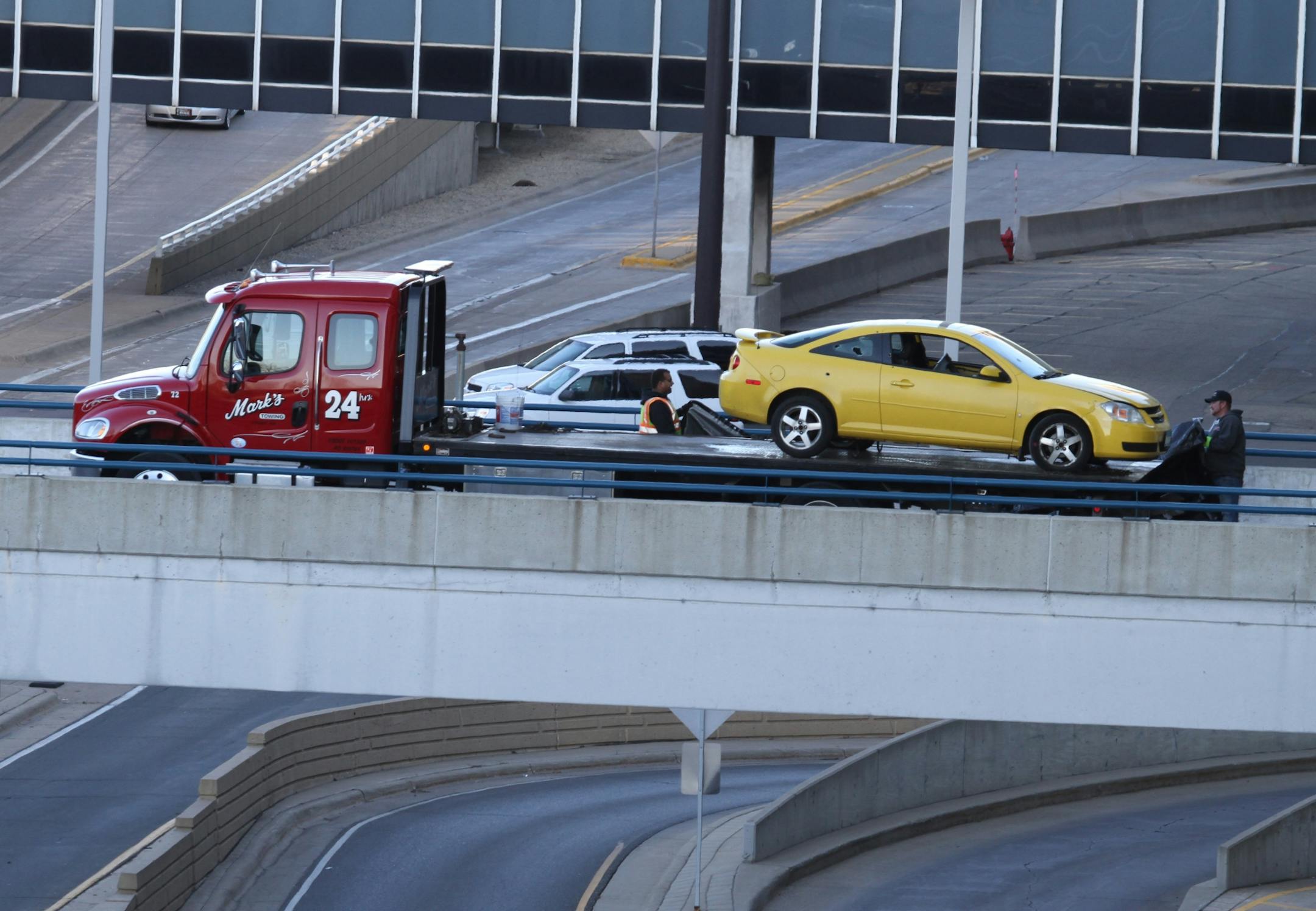 At Minneapolis St Paul airport Sunday, tow operators load a car involved in an incident with shots fired by police. On April 25, at approximately 9:30pm, Minneapolis-St. Paul International Airport Police (MSP Airport Police) responded to a report of suspicious persons at the Terminal 1 rental car ramp on the second level. During their investigation, a vehicle intentionally drove at the officers who were on foot. Officers fired on the vehicle. An adult male suspect who was driving was taken to an