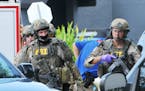 FBI, Orlando Police Department and the Orange County Sheriff's Office personnel investigate the attack at the Pulse nightclub in Orlando Fla., Sunday,