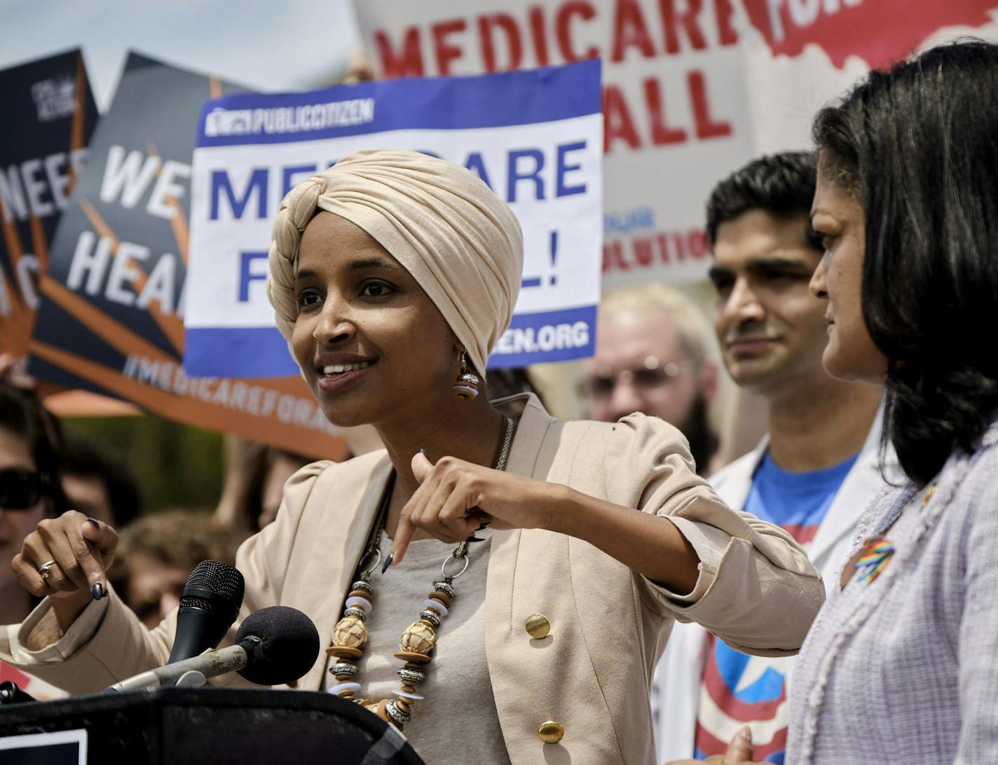 Rep. Ilhan Omar (D-Minn.), with Rep. Pramila Jayapal (D-Wash.), speaks during a news conference on the Medicare for All Act of 2019 outside the House of Representatives in Washington, June 12, 2019. (T.J. Kirkpatrick/The New York Times)