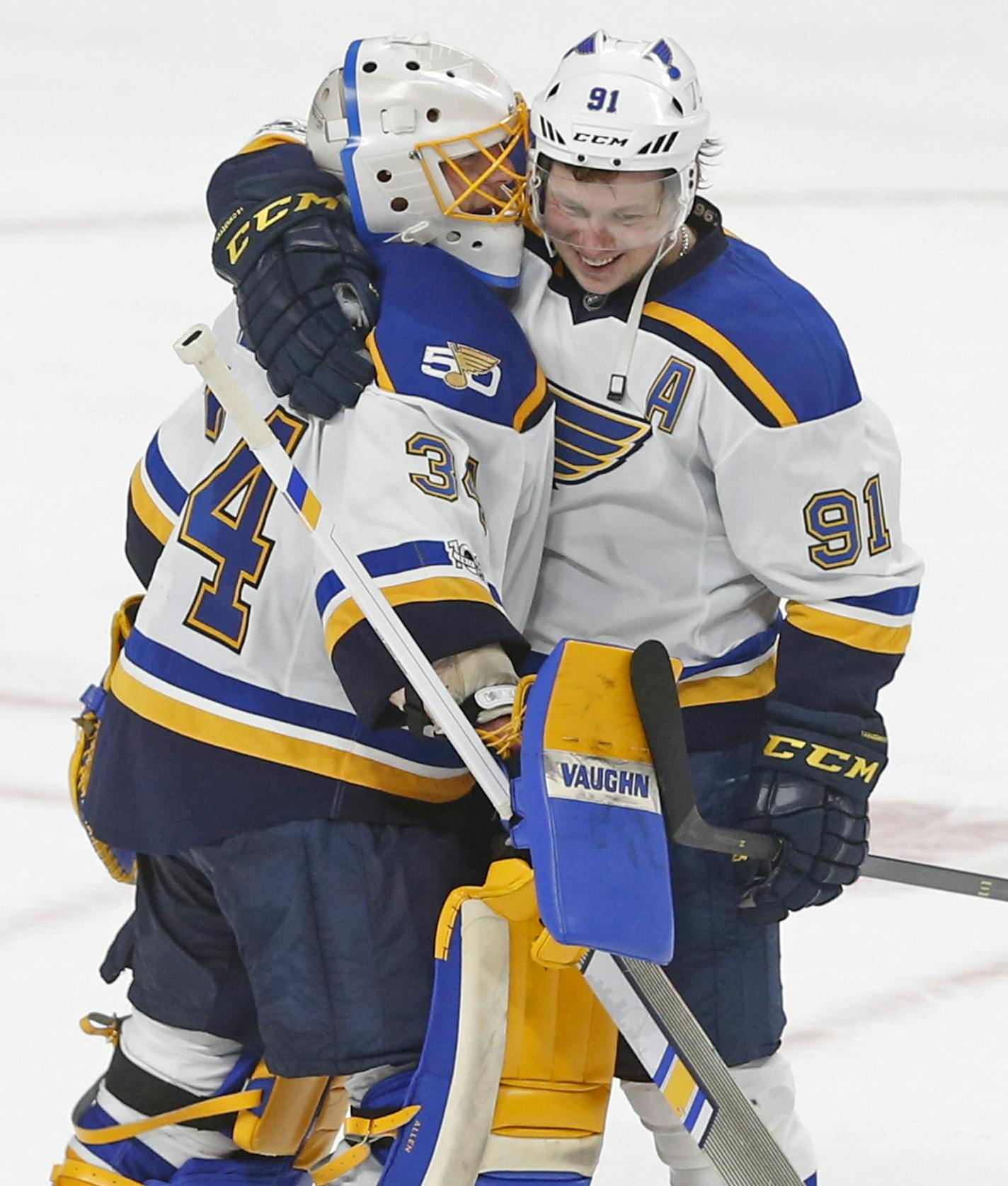 St. Louis Blues' Vladimir Tarasenko, right, of Russia, and goalie Jake Allen celebrate the Blues' 2-1 win over the Minnesota Wild in an NHL hockey game Tuesday, March 7, 2017, in St. Paul, Minn. Tarasenko scored the second goal of the game. (AP Photo/Jim Mone)