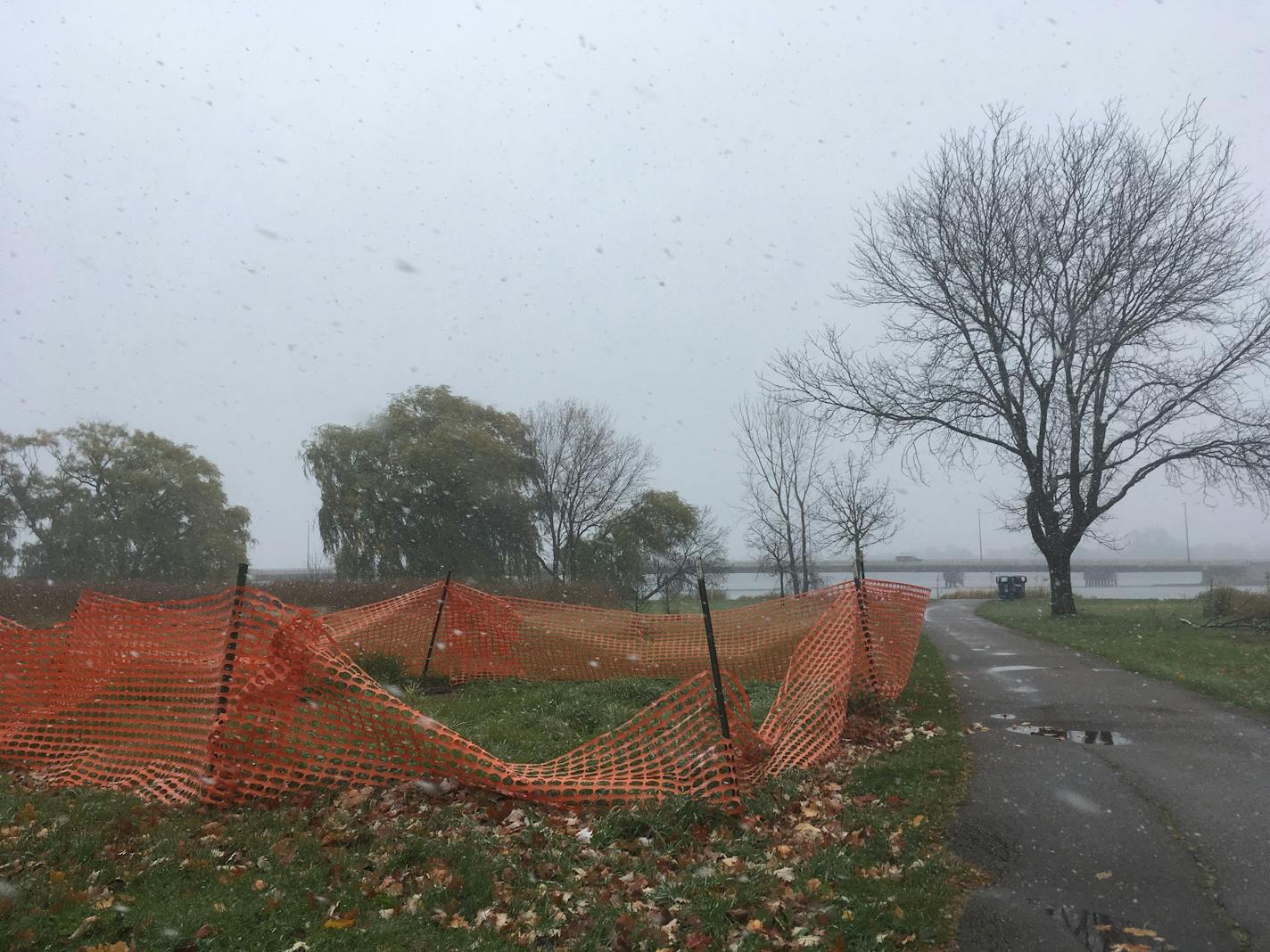 A sinkhole west of Lake Nokomis was fenced off Friday. It's one of several in the area. Cedar Avenue is in the background.