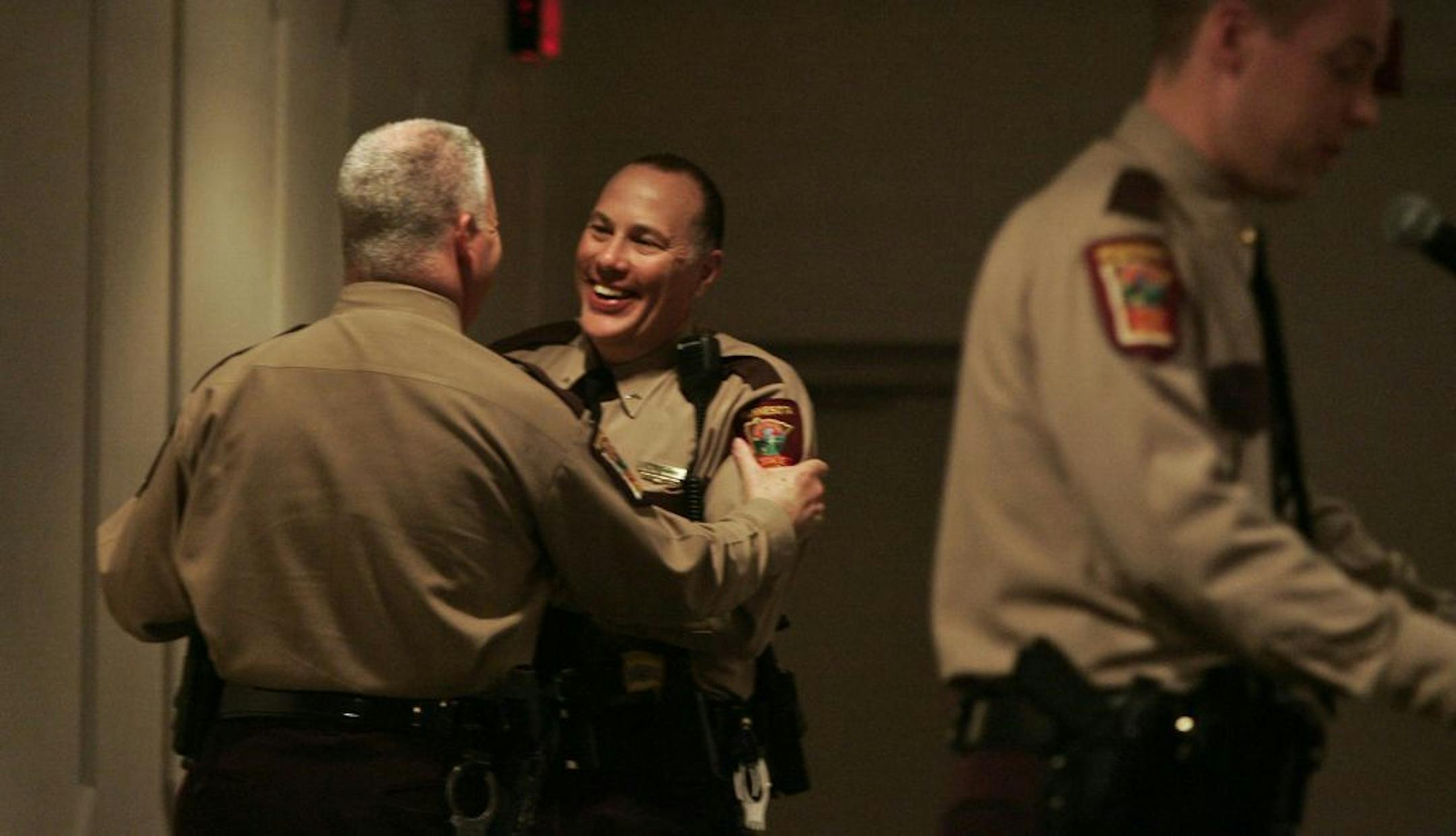 Patrol Lt. Col. Kevin Daly shook hands with trooper Ron Richards , right, who was named Minnesota Trooper of the Year 2010.