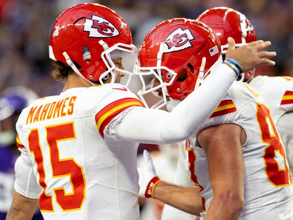 Chiefs quarterback Patrick Mahomes celebrates with tight end Travis Kelce, right, after a touchdown in the third quarter.