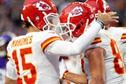 Chiefs quarterback Patrick Mahomes celebrates with tight end Travis Kelce, right, after a touchdown in the third quarter.