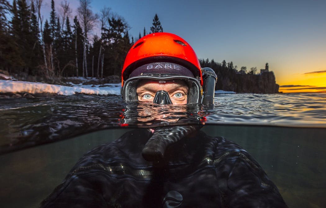 Christian Dalbec has carved out an unusual niche in nature photography. He puts on a wet suit and swims out into Lake Superior to capture waves, surfers and selfies.