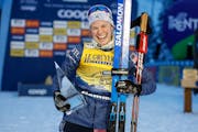 United States's Jessie Diggins poses with the trophy after winning the cross-country ski, women's Tour de Ski overall standings, in Val di Fiemme, Ita