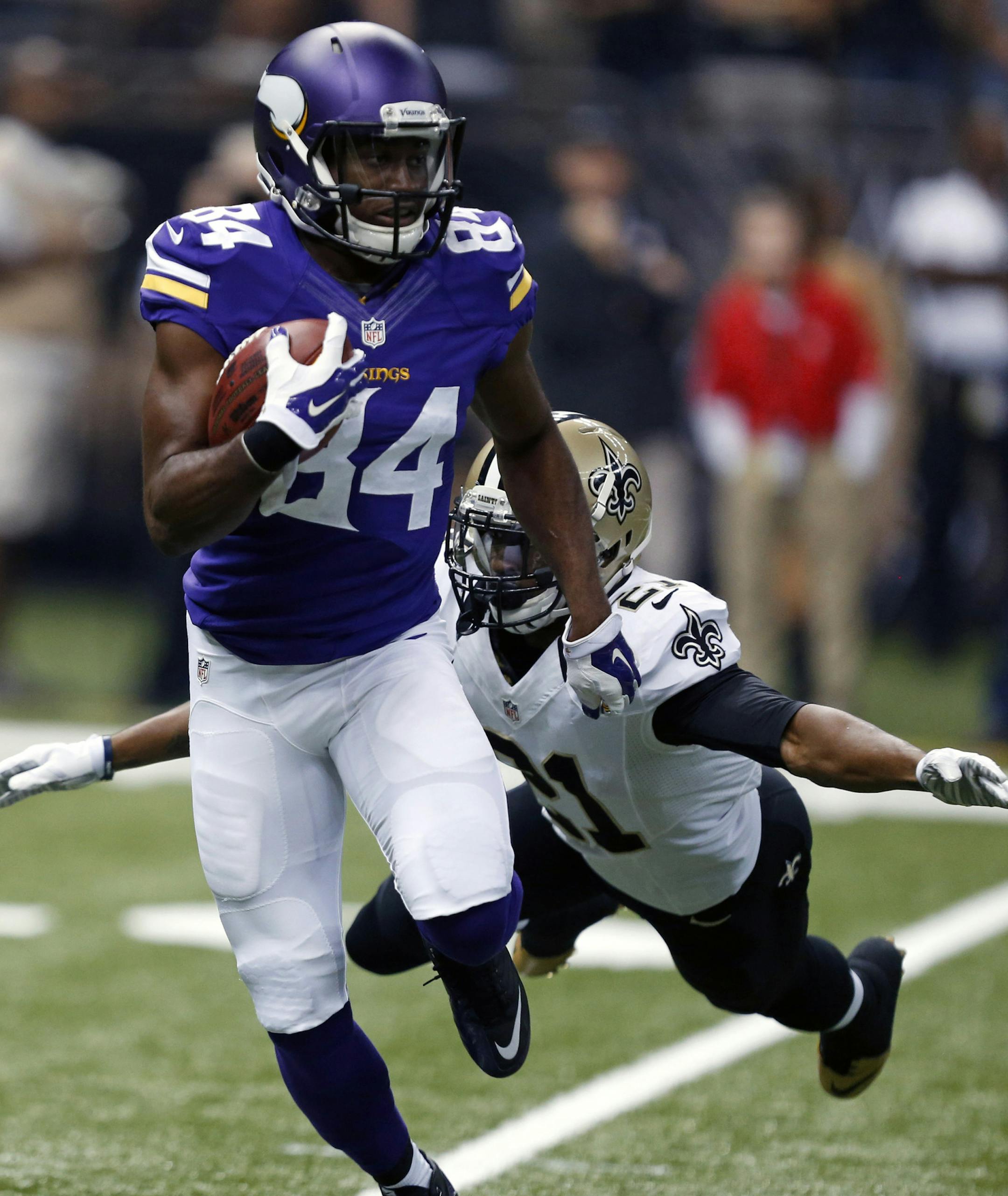 Minnesota Vikings wide receiver Cordarrelle Patterson (84) carries as New Orleans Saints cornerback Patrick Robinson (21) tries to tackle in the first half of an NFL football game in New Orleans, Sunday, Sept. 21, 2014. (AP Photo/Rogelio Solis) ORG XMIT: LAGH104