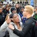 Morgan State junior Cayln Taylor is held back as she screams at a Morgan State official, not pictured, that was trying to clear the intersection durin