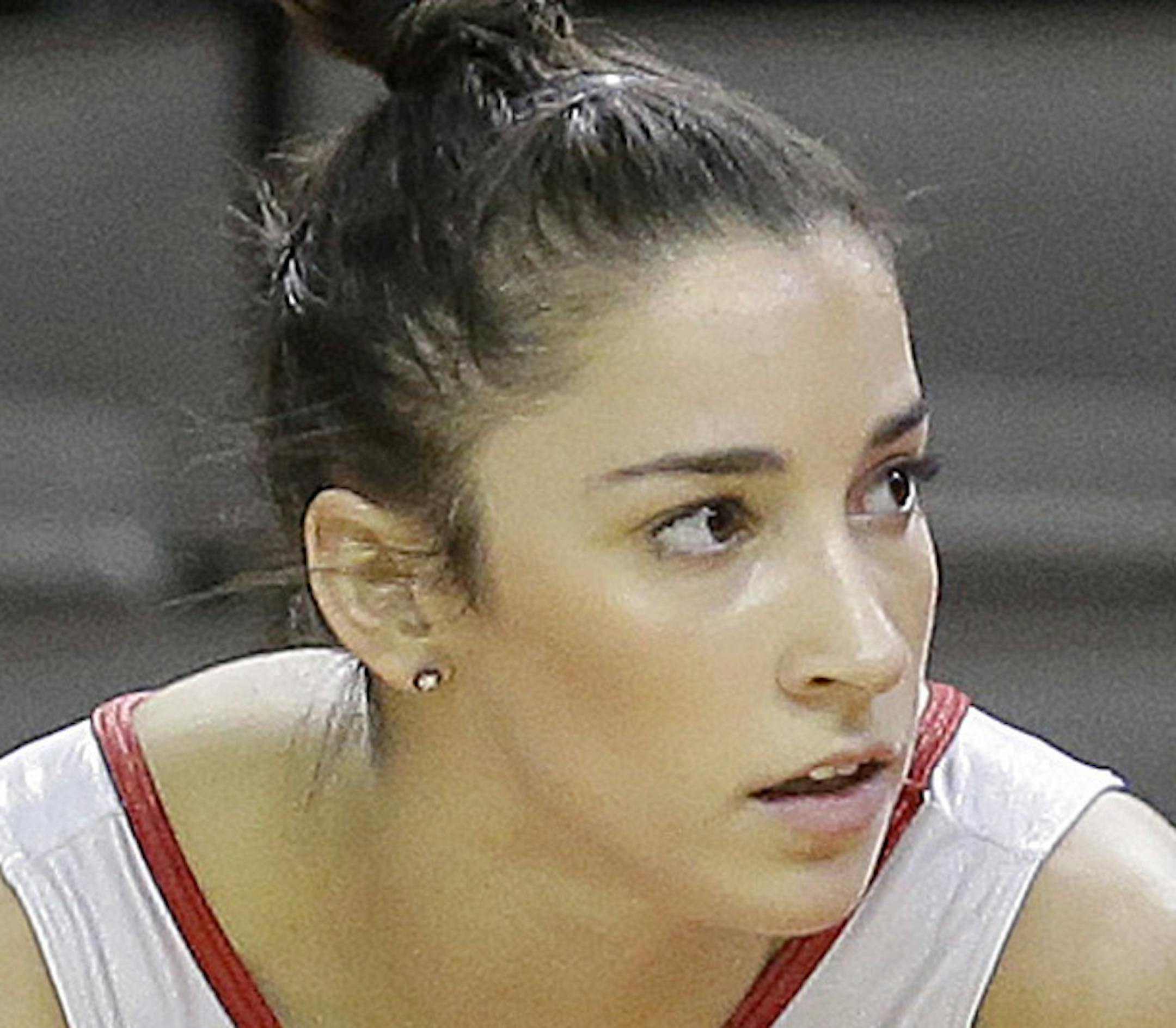Aly Raisman prepares to perform a floor exercise routine during practice at the U.S. Olympic trials in gymnastics in San Jose, Calif., Thursday, July 7, 2016. (AP Photo/Jeff Chiu)