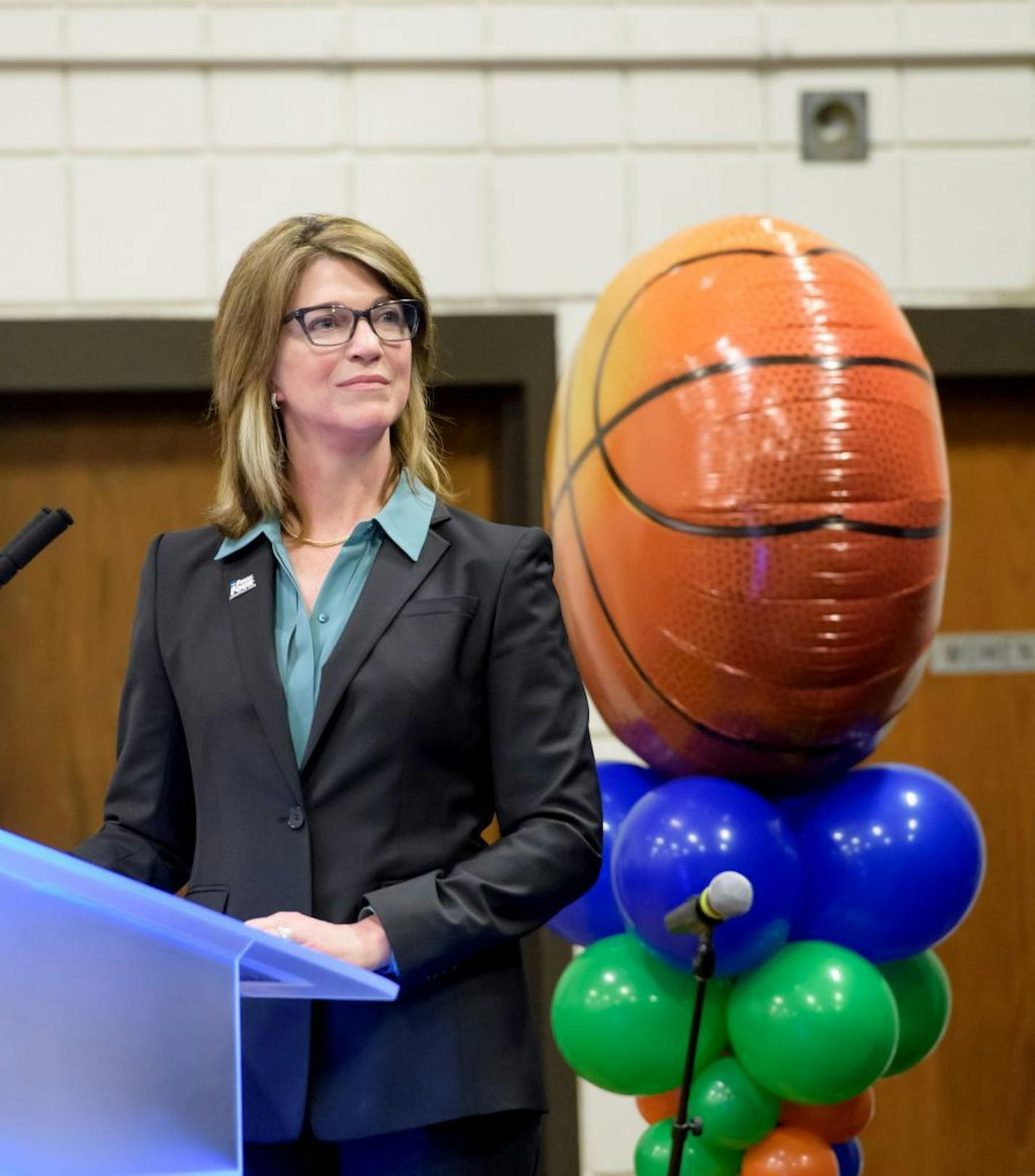 Kate Mortenson, MLOC president and CEO watched as the logo was unveiled.