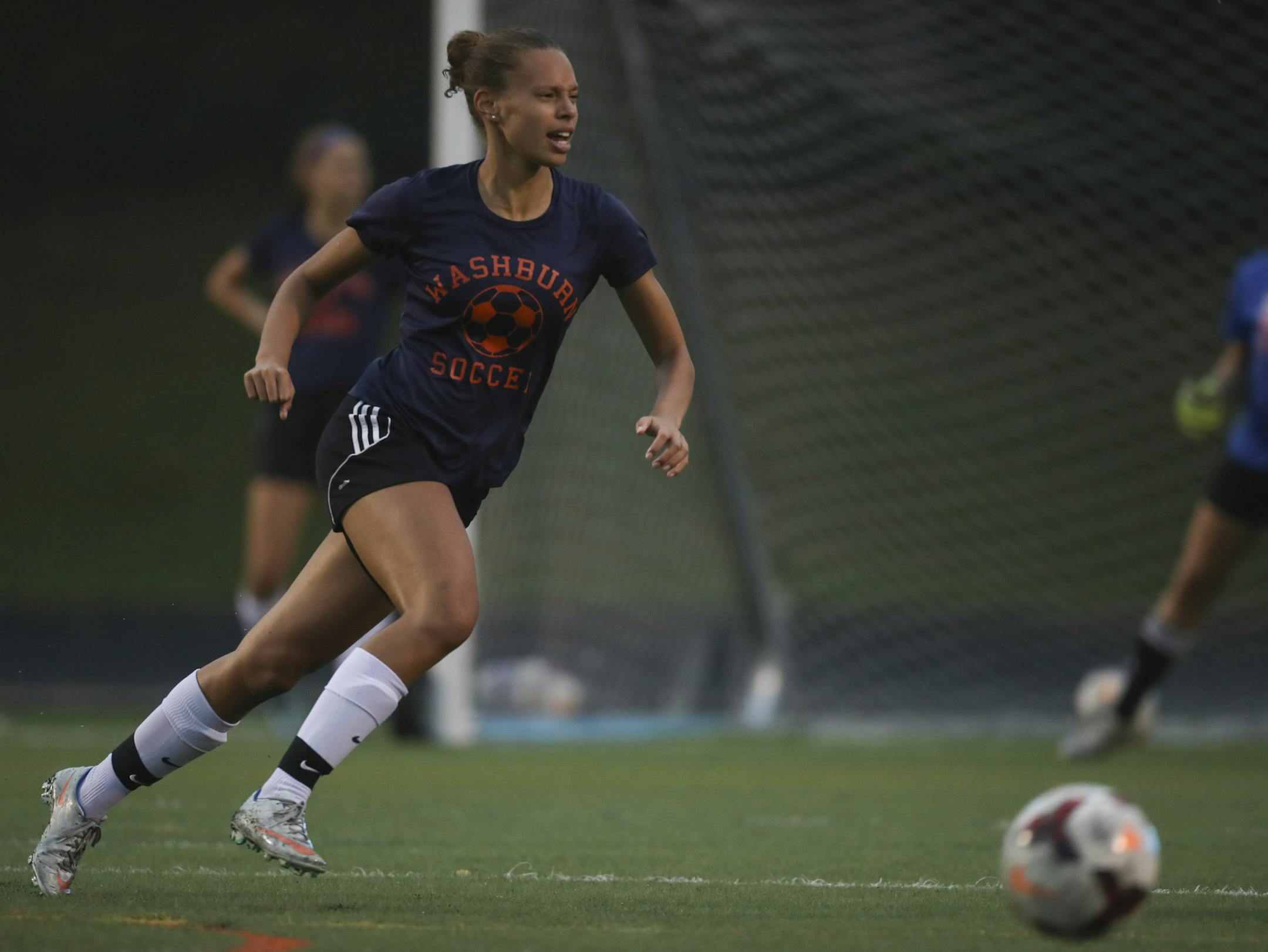 Washburn senior co-captain Charlotte DeVaughn during a drill at practice in the rain Monday after school. ] JEFF WHEELER ï jeff.wheeler@startribune.com The Washburn Millers girl's soccer team heads into the playoffs next week. The team practiced in the rain Monday, October 2, 2017 after school. Charlotte DeVaughn has been one of the state's best girls' soccer players since her freshman season. She could be a terrific scorer or game-controlling midfielder, but she plays defense, where the Mi