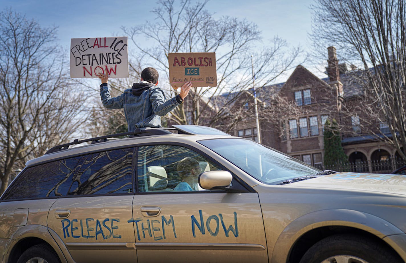 Activists who stayed mostly in their cars for social distancing, lined Summit Ave, honking horns outside the Governor's Residence in St Paul. The were calling for the release of high risk prisoners and ICE detainees from MN facilities to lower the chances of infection. ] GLEN STUBBE &#x2022; glen.stubbe@startribune.com Friday, March 27, 2020