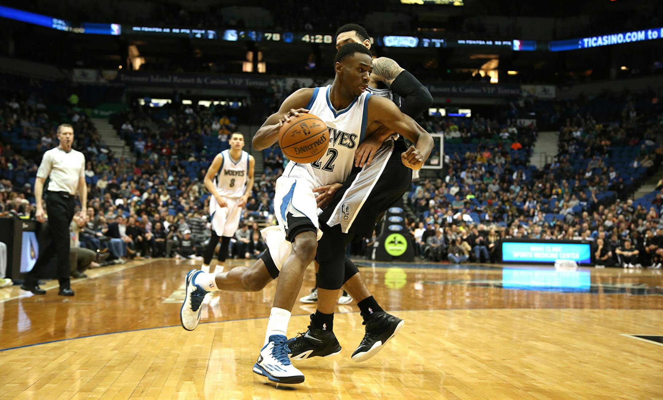 The Wolves Andrew Wiggins made a move to the basket against Spurs Danny Green during the second half. ] (KYNDELL HARKNESS/STAR TRIBUNE) kyndell.harkness@startribune.com Timberwolves vs San Antonio at the Target Center in Minneapolis Min., Saturday, January 10, 2014. Spurs won over the Wolves 108-93.
