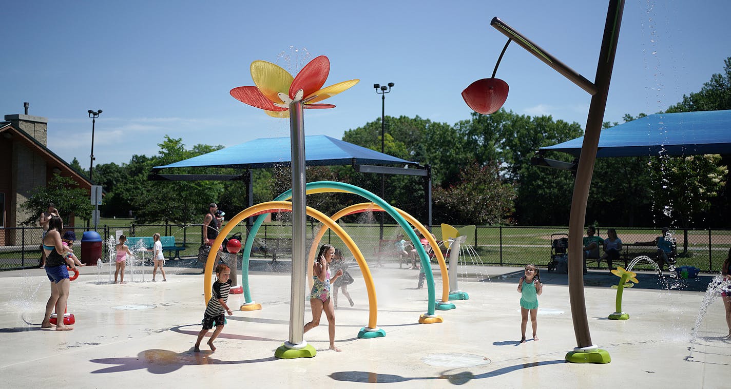 As some outdoor pools reopen this pandemic summer, there are a few new rules besides the standard "no running on deck!" At the Oak Hill Park Splash Pad, in St. Louis Park had a limit of 75 people at one time. brian.peterson@startribune.com Minneapolis, MN Thursday, June 25, 2020