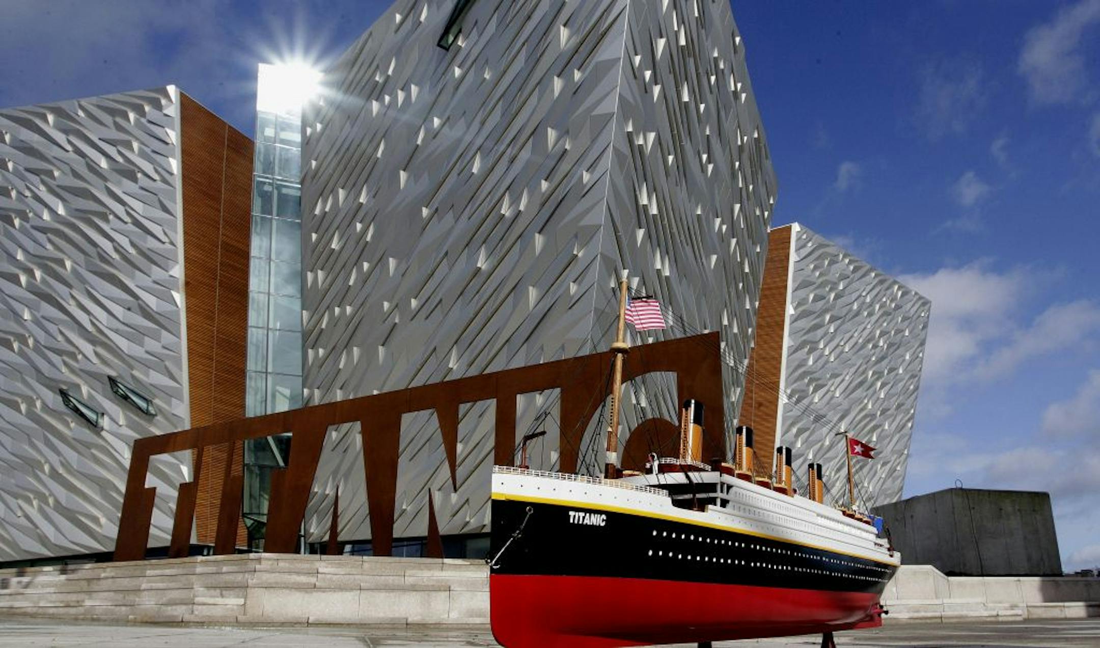 A model of the Titanic is seen beside the new Titanic Belfast visitor centre in Northern Ireland