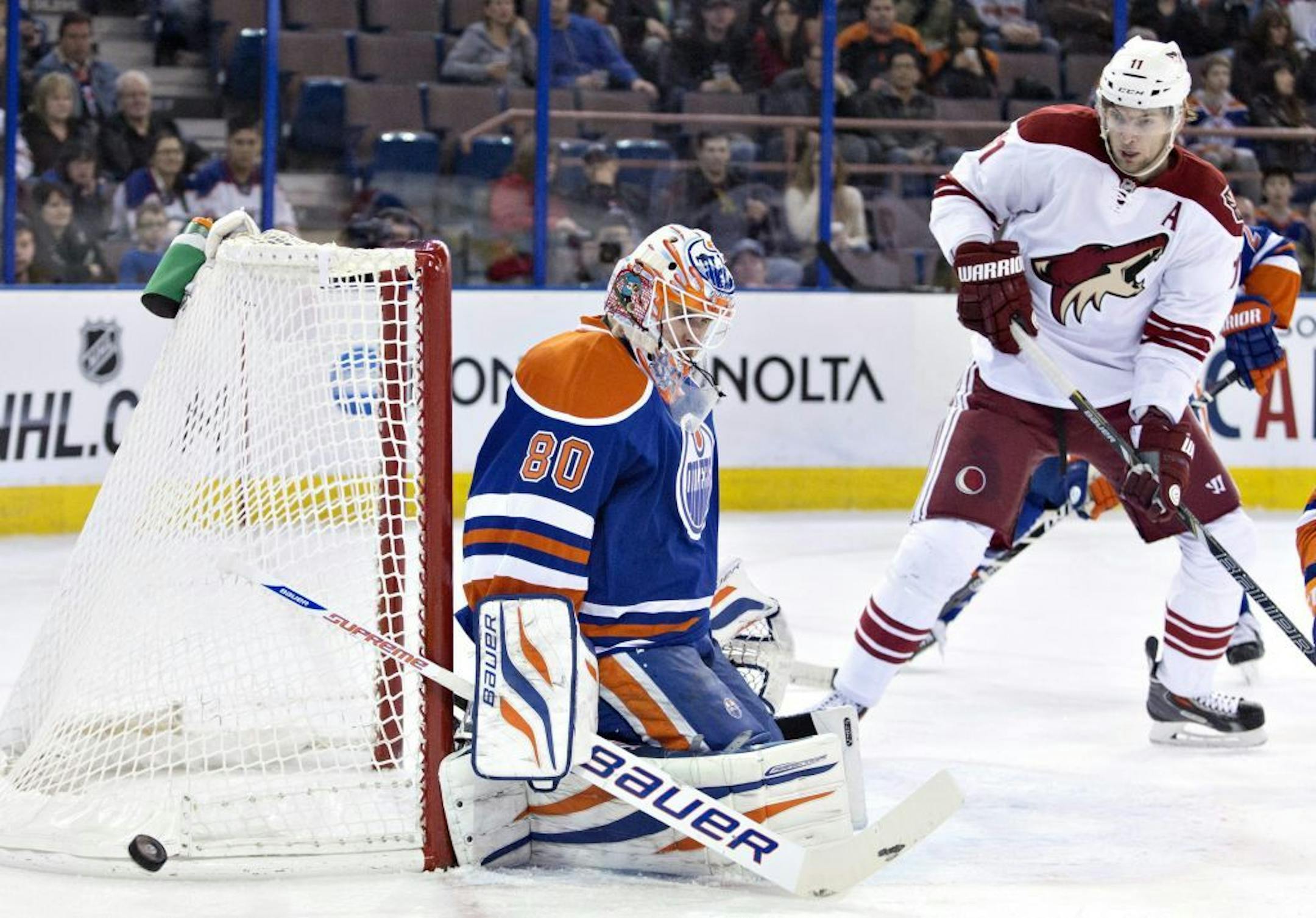 Phoenix Coyotes' Martin Hanzal (11) is stopped by Edmonton Oilers goalie Ilya Bryzgalov (80) during the first period of an NHL hockey game Friday, Jan. 24, 2014, in Edmonton, Alberta.