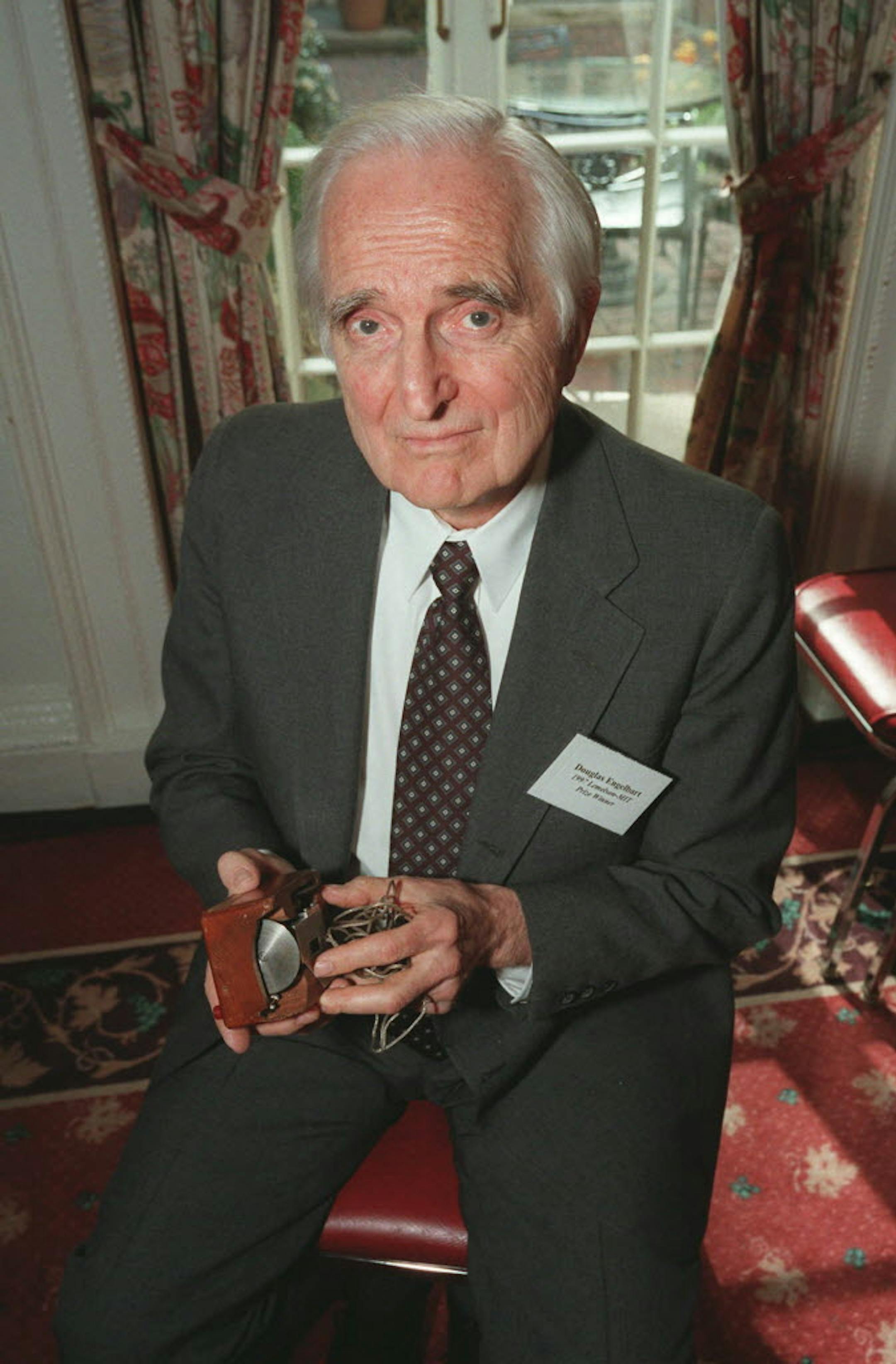 April 9, 1997: Doug Engelbart, inventor of the computer mouse and winner of the half-million dollar 1997 Lemelson-MIT prize, poses with the computer mouse he designed.