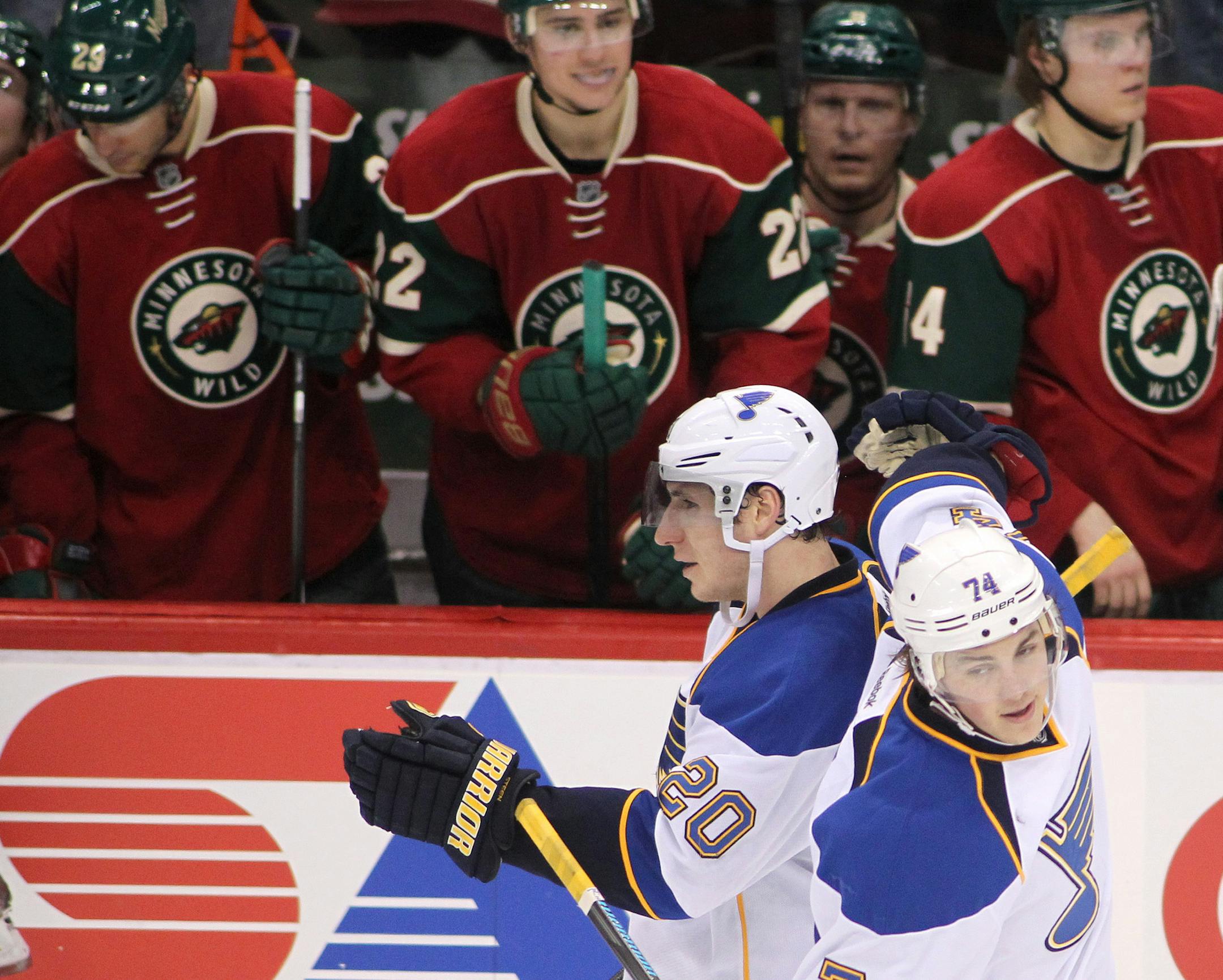 St. Louis Blues left wing Alexander Steen (20) is congratulated by St. Louis Blues right wing T.J. Oshie (74) after both scored on Minnesota Wild goalie Ilya Bryzgalov (30) in the shoot out during their NHL hockey game Sunday, March 9, 2014 in St. Paul, Minn.. The Blues defeated the Wild 3-2 in a shootout.(AP Photo/Andy Clayton-King)