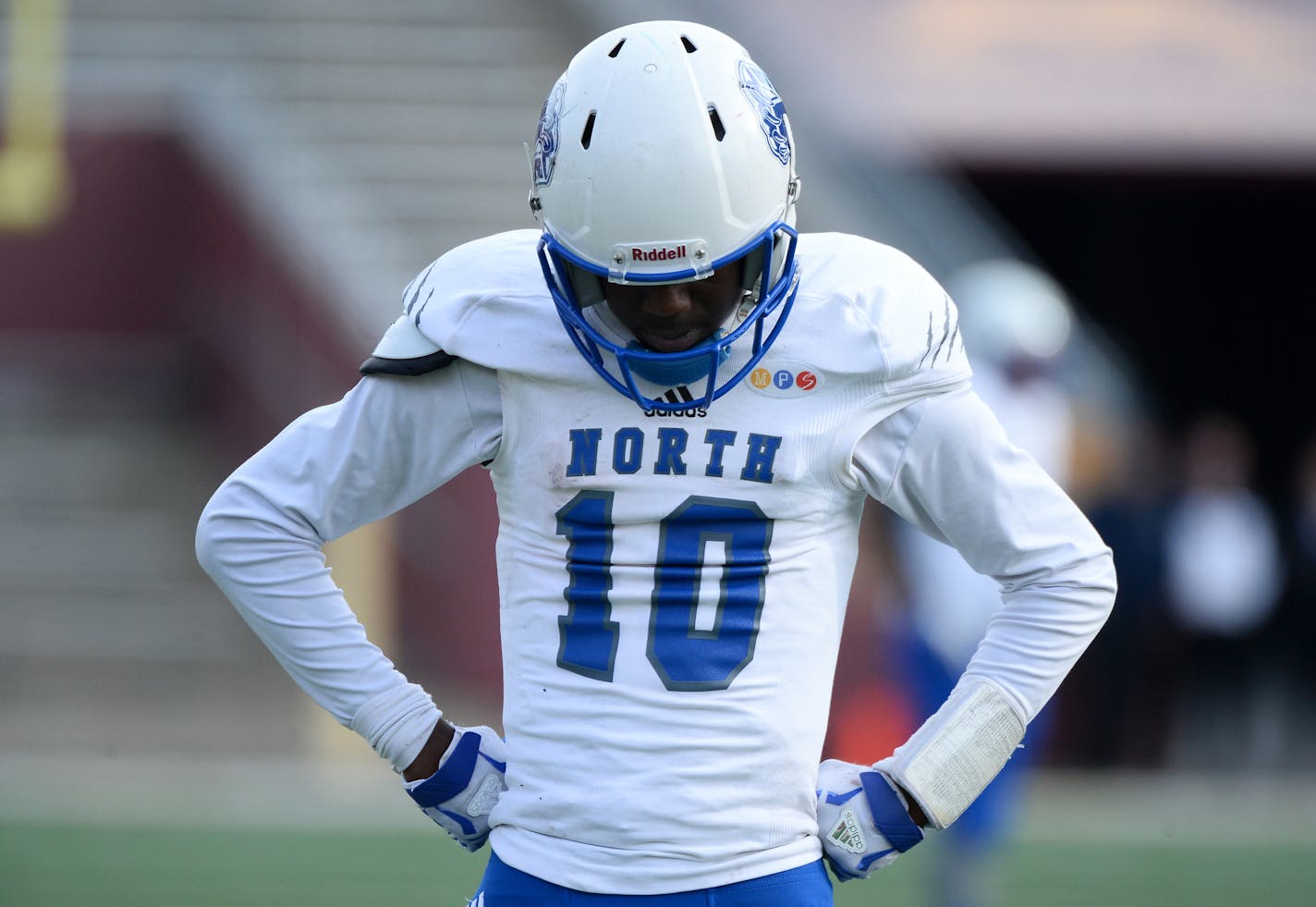 Minneapolis North quarterback Tyler Johnson (10) was dejected in the final minutes of Saturday's 1A championship loss against Minneota. ] (AARON LAVINSKY/STAR TRIBUNE) aaron.lavinsky@startribune.com Minneapolis North played Minneota in the Class 1A championship game on Saturday, Nov. 14, 2015 at TCF Bank Stadium.