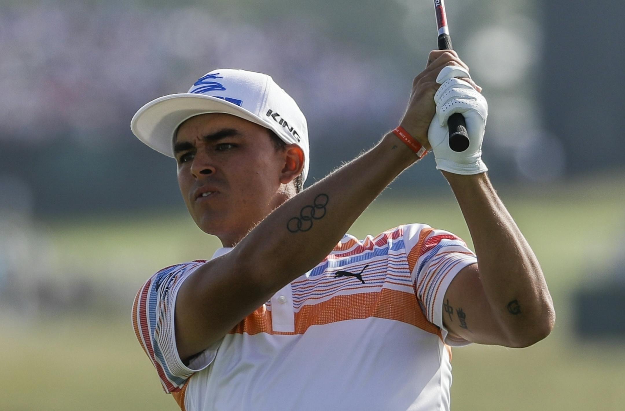 Rickie Fowler hits on the 12th hole during the first round of the U.S. Open golf tournament Thursday, June 15, 2017, at Erin Hills in Erin, Wis. (AP Photo/David J. Phillip)