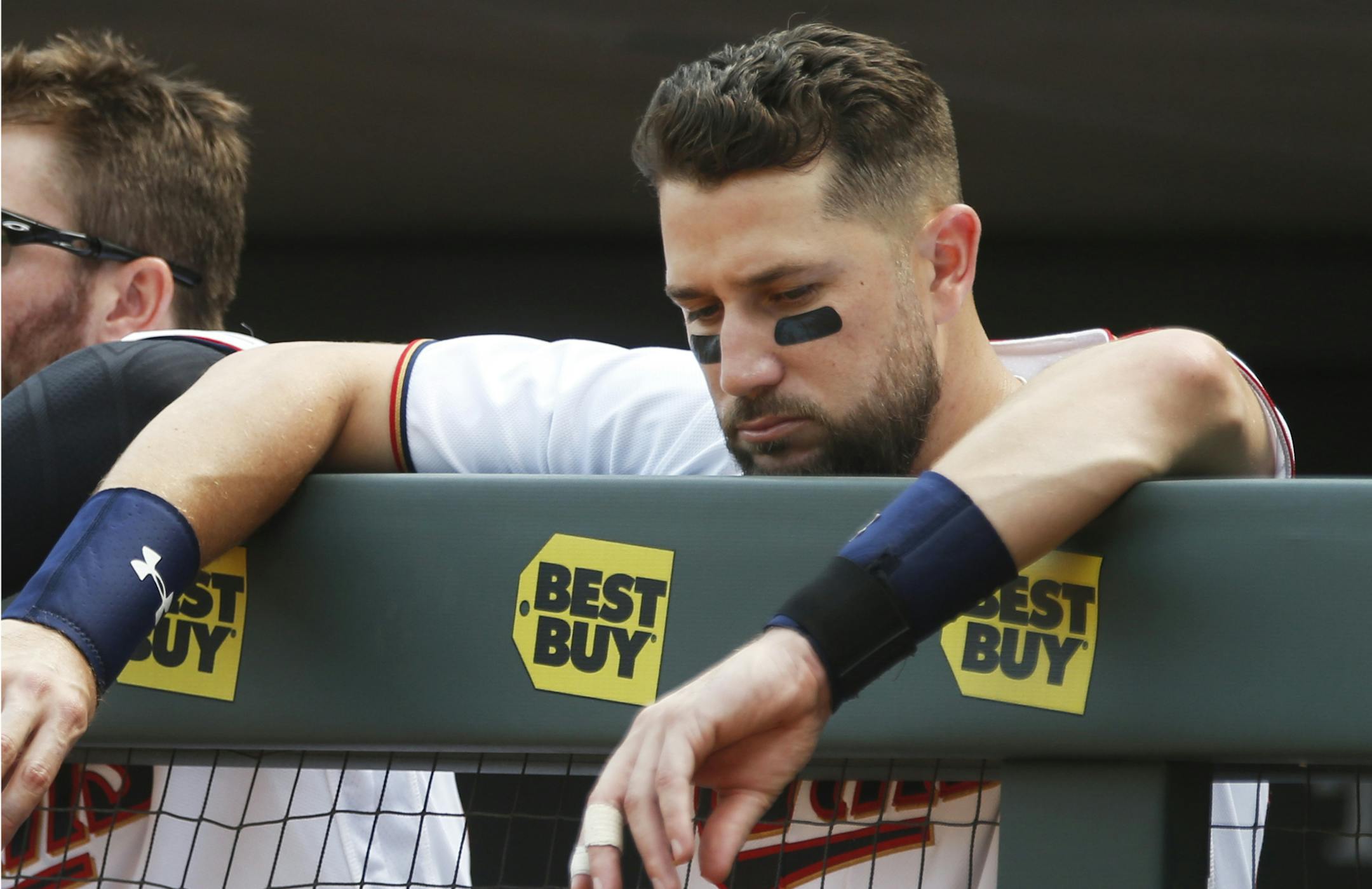 Minnesota Twins' Trevor Plouffe leans on the dugout rail in the waning moments of the Twins 8-5 loss to the Detroit Tigers in a baseball game Thursday, Aug. 25, 2016, in Minneapolis. The Tigers won 8-5, sweeping the three-game series and handing the Twins their seventh straight loss. (AP Photo/Jim Mone) ORG XMIT: MNJM112
