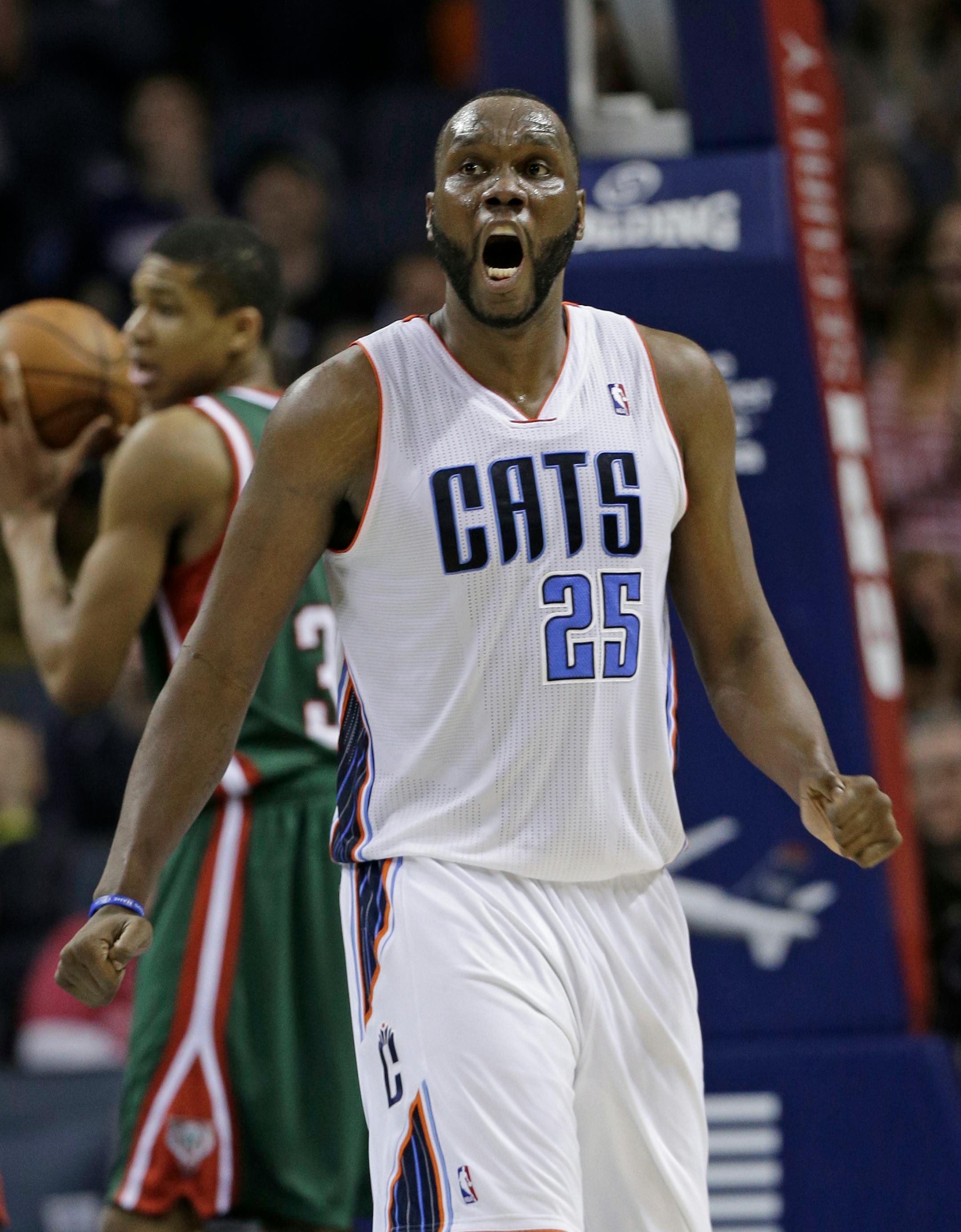 Charlotte Bobcats' Al Jefferson (25) reacts after making a basket and being fouled by the Milwaukee Bucks during the second half of an NBA basketball game in Charlotte, N.C., Monday, Dec. 23, 2013. The Bobcats won 111-110 in overtime. (AP Photo/Chuck Burton)