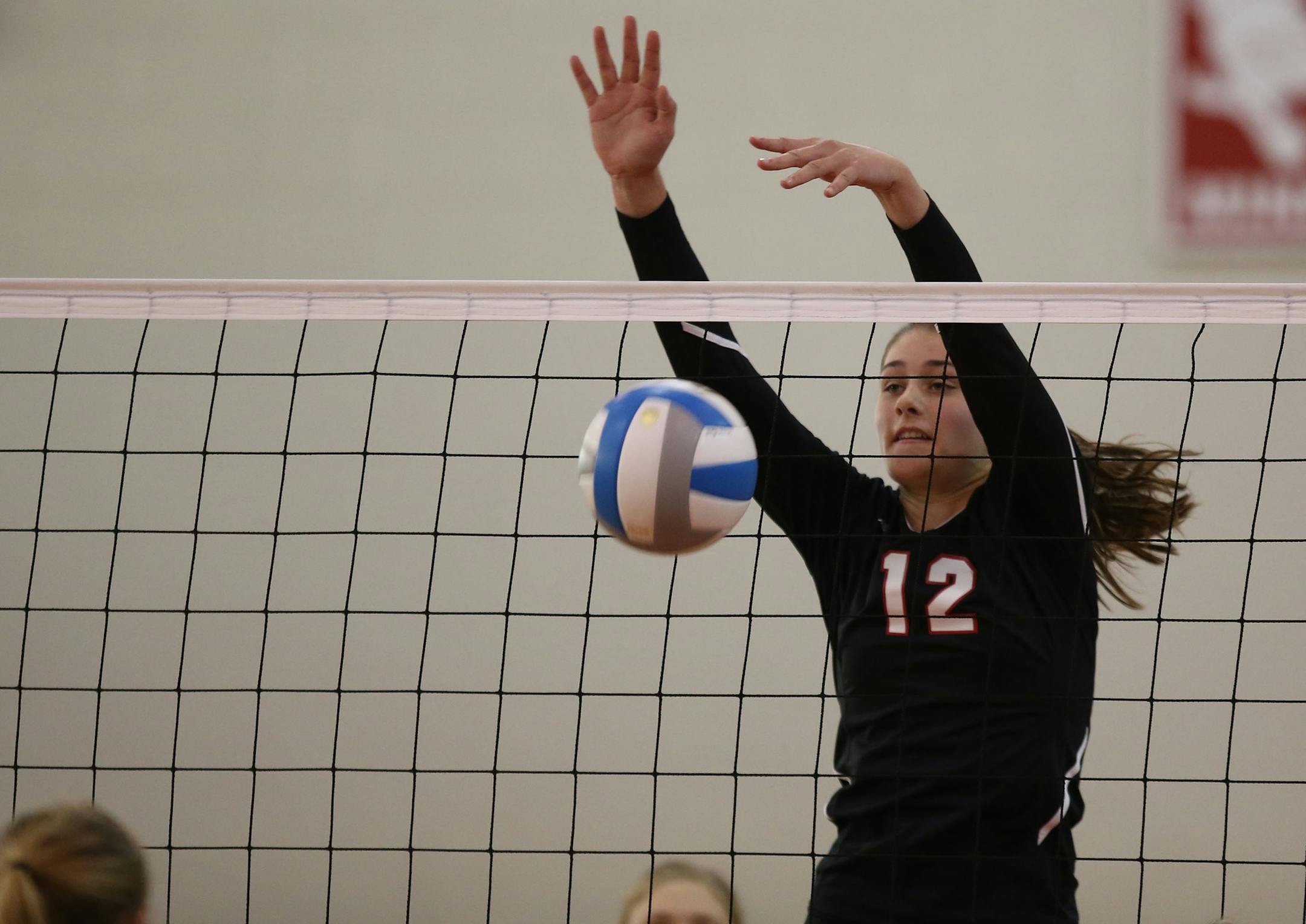 Eden Prairie's Grace Persson blocked a Wayzata spike. ] (KYNDELL HARKNESS/STAR TRIBUNE) kyndell.harkness@startribune.com Sectional finals Eden Prairie vs Wayzata in St. Louis Park Min., Saturday, November 1, 2014. Eden Prairie won over Wayzata 3-0.