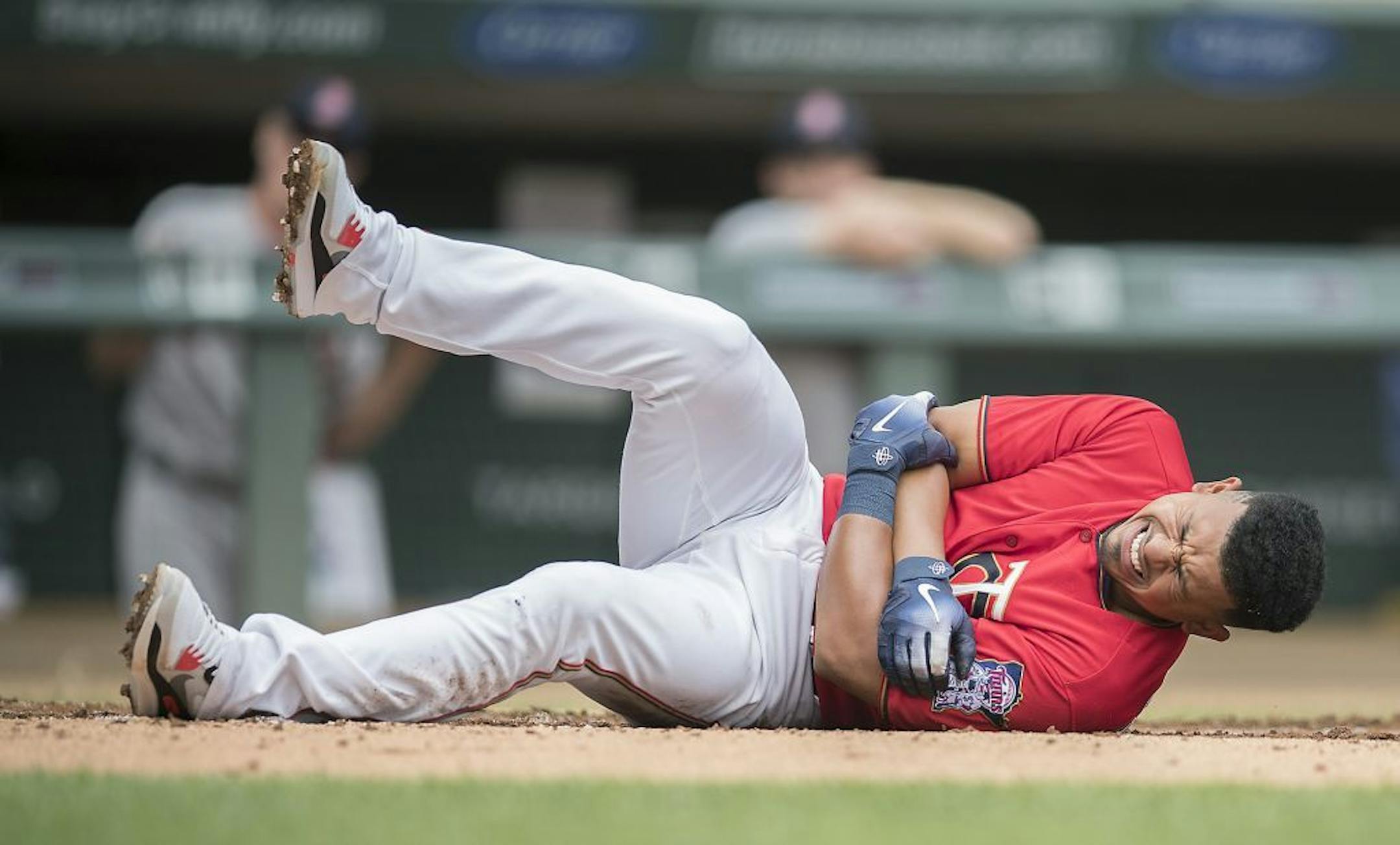 Eduardo Escobar goes down after he was hit by Red Sox pitcher Rick Porcello during the first inning as the Twins took on the Boston Red Sox at Target Field, Thursday, June 21, 2018 in Minneapolis, MN.
