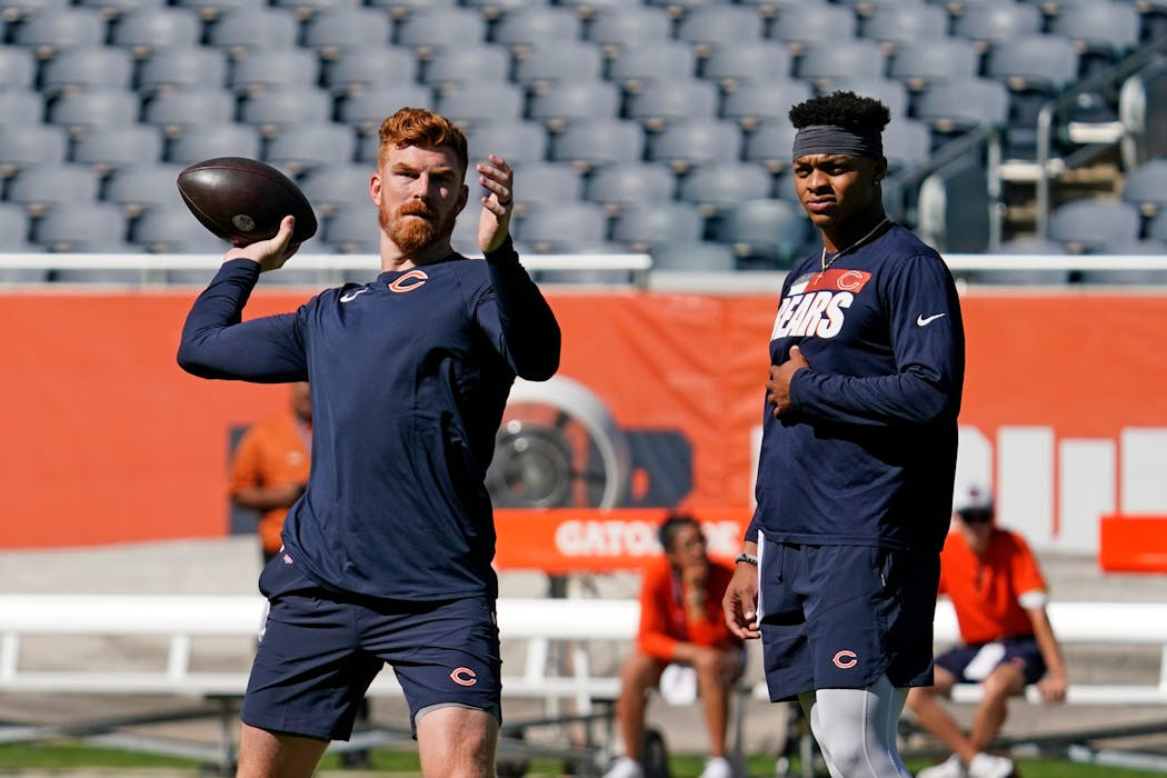 The Bears have the NFL's hottest quarterback controversy with Andy Dalton, left, and Justin Fields.  