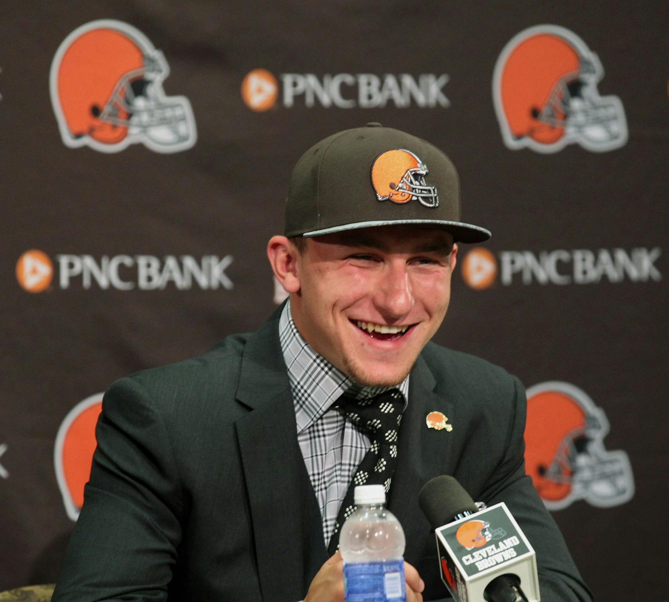 Cleveland Browns first round draft choices Johnny Manziel flashes his smile for members of the media gathered at the team's headquarters on Friday, May 9, 2014, in Berea, Ohio. (Phil Masturzo/Akron Beacon Journal/MCT)