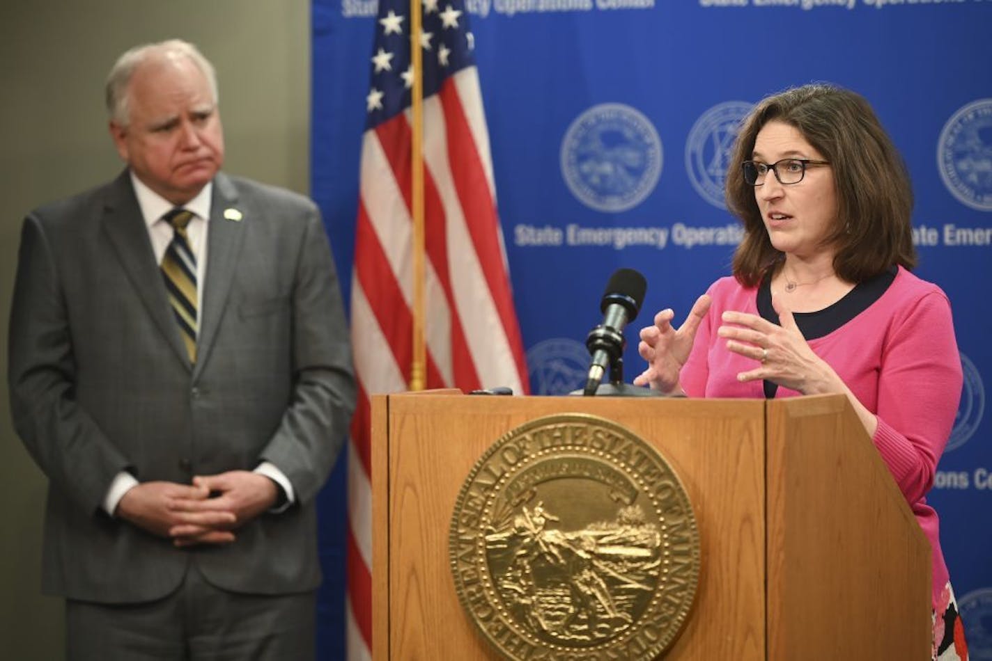 Minnesota Education Commissioner Mary Cathryn Ricker speaks, as Gov. Tim Walz listens during a news conference concerning the state's efforts against the new coronavirus, Thursday, April 23, 2020, in St. Paul, Minn.