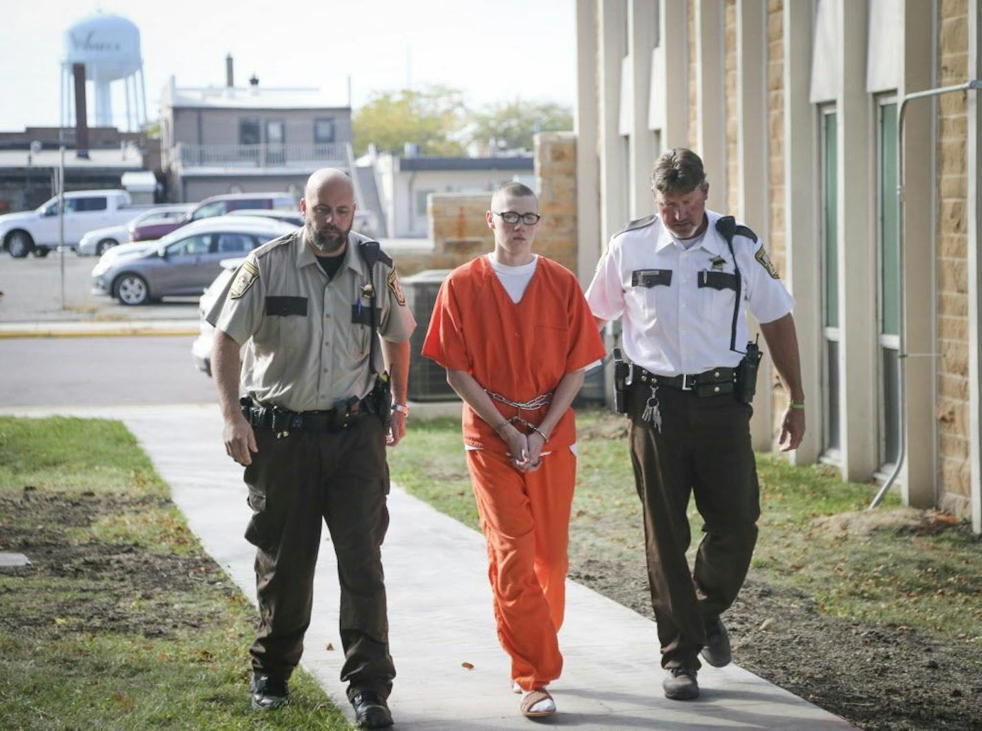 John LaDue walked into the Waseca County Courthouse flanked by officers to his sentencing in Waseca, Minn., on Monday, October 19, 2015.