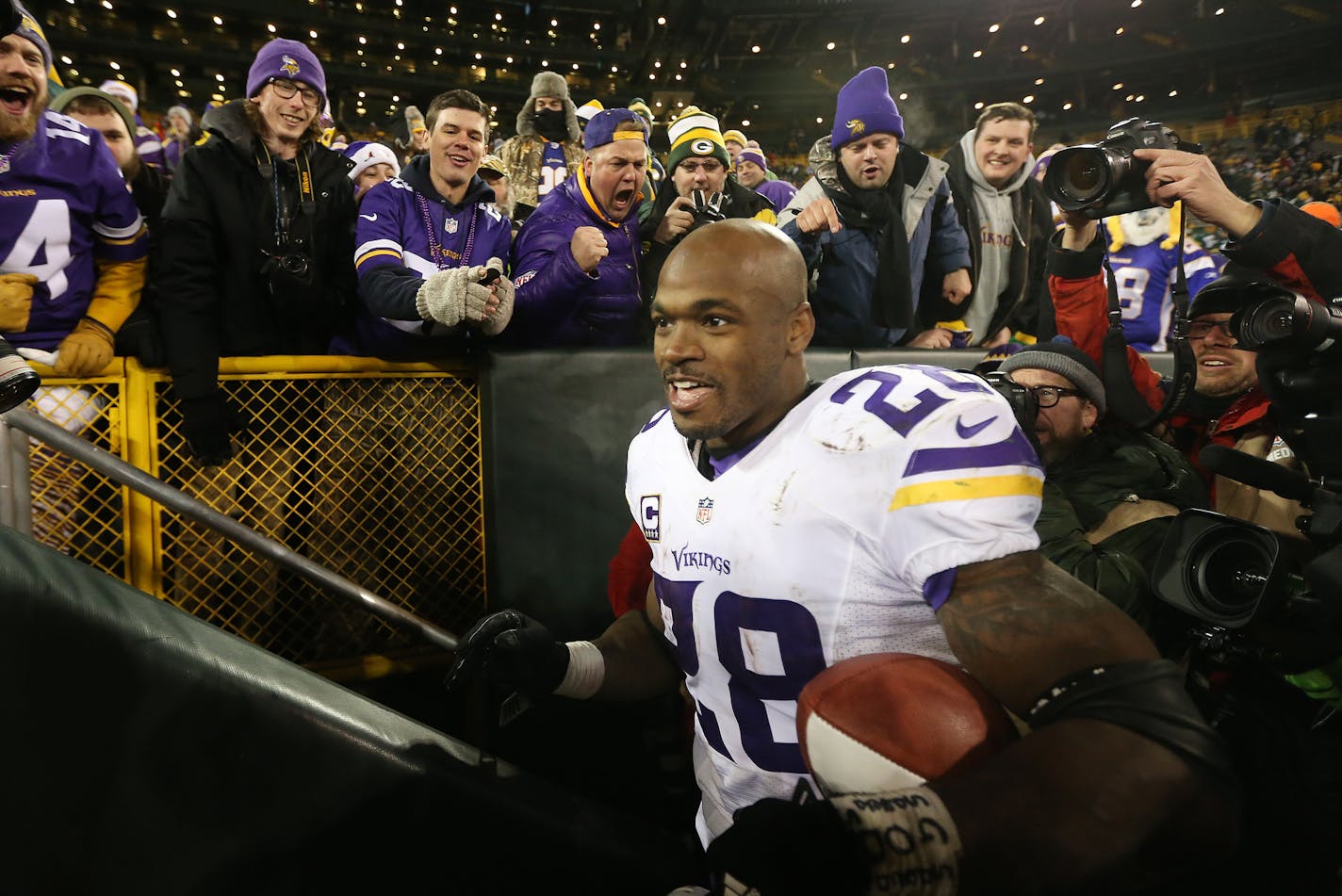 Minnesota Vikings running back Adrian Peterson (28) celebrated with fans after there win Sunday January 3, 2016 in Green Bay, Wisconsin. ] The Green Bay Packers faced the Minnesota Vikings at Lambeau Field for NFC north title. Jerry Holt/Jerry.Holt@Startribune.com