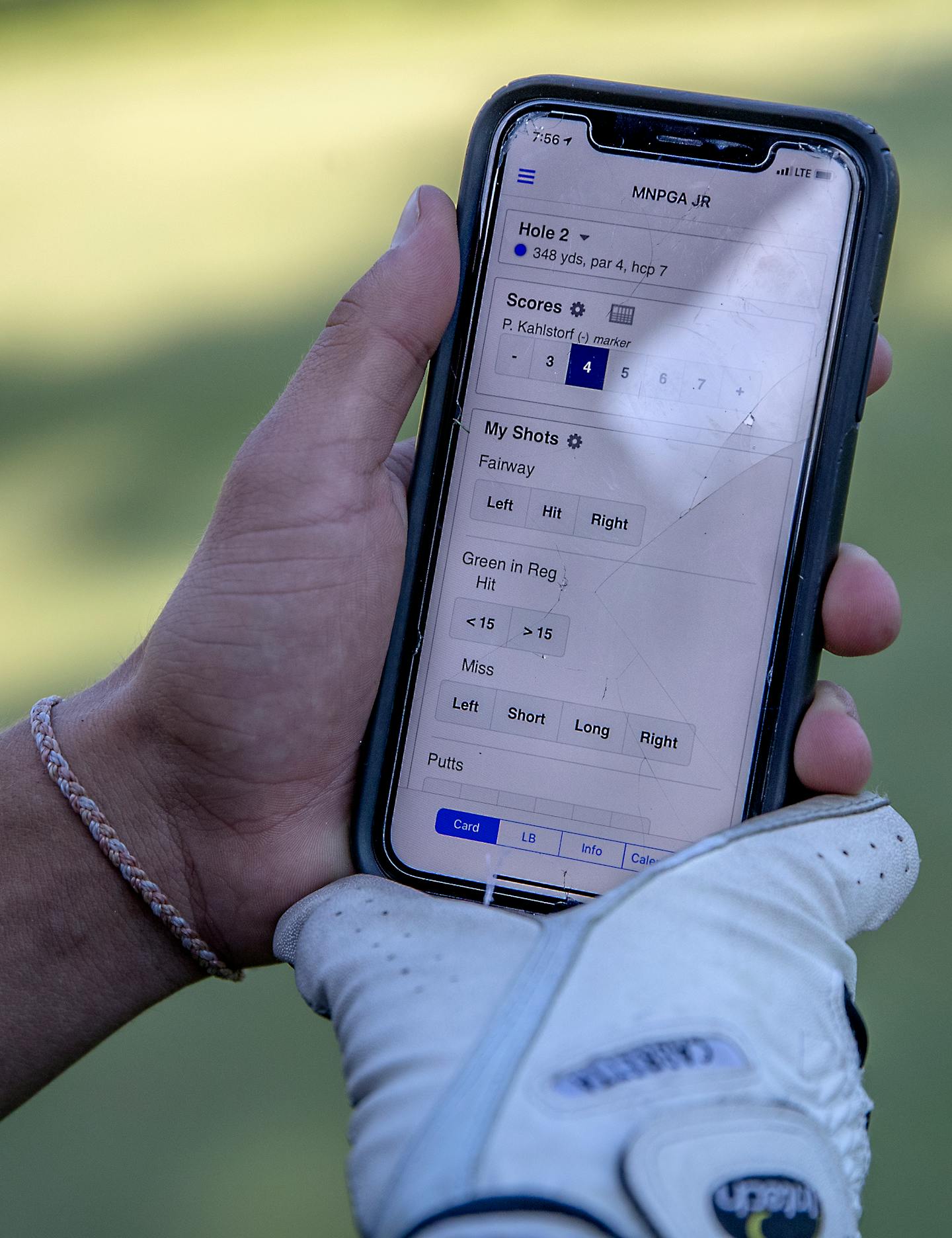 Champlin Park's Parker Kahlstorf kept score on a golf app on his phone during the Minnesota Senior Showcase