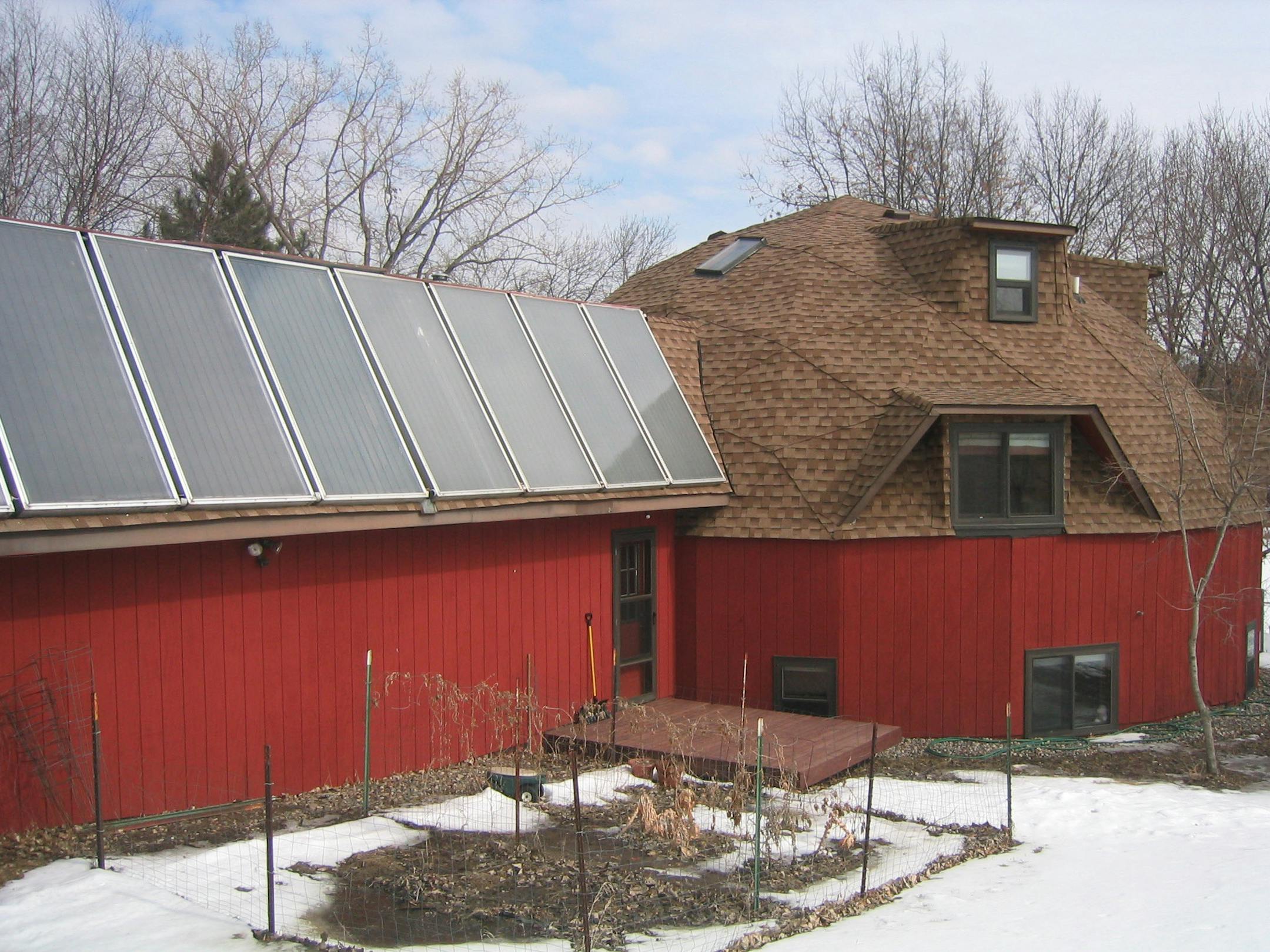 This energy-efficient geodesic home in Mendota Heights has a solar panel system on the garage roof that helps heat the home's water. The home is on a lakeside lot almost an acre in size.