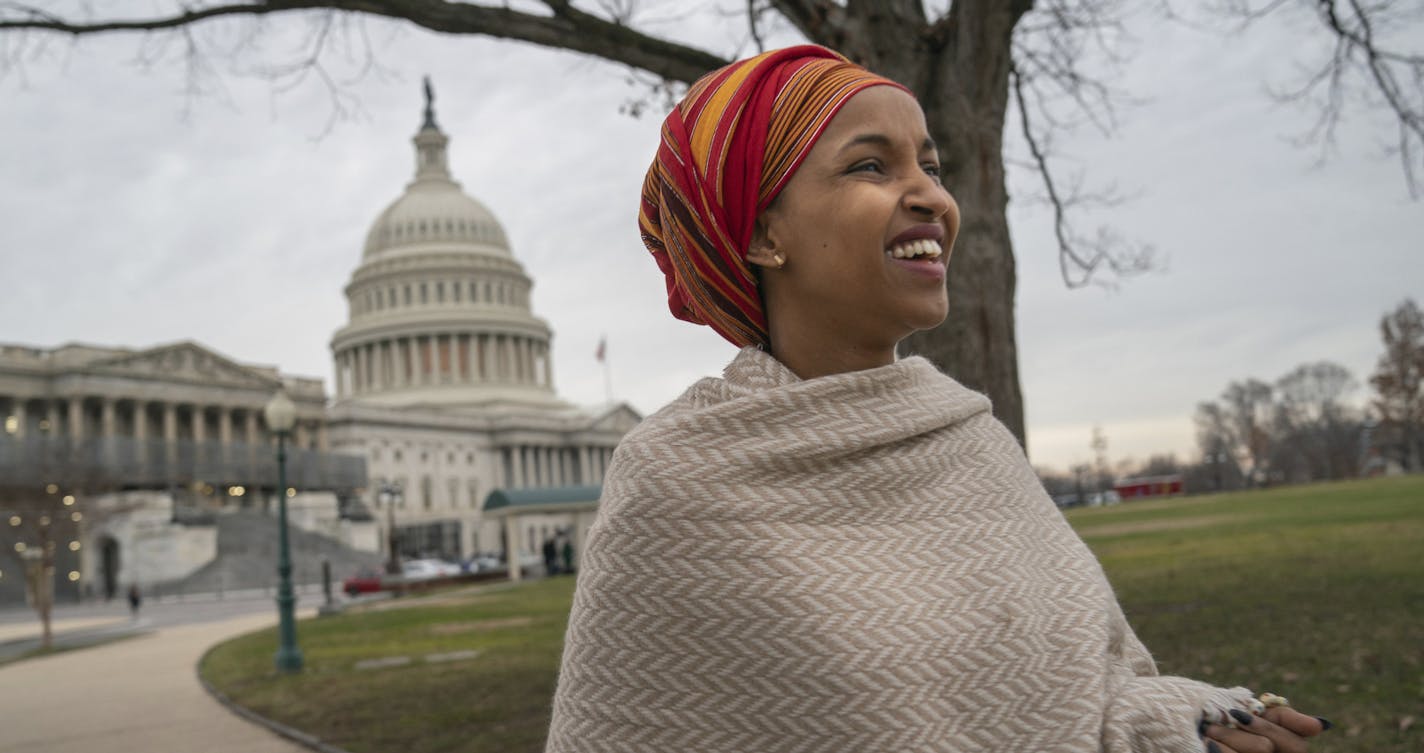 Rep. Ilhan Omar, a freshman Democrat representing Minnesota's 5th Congressional District, walks from her new office in the Longworth House Office Building to the U.S. Capitol before she was sworn in on the first day of the 116th Congress, Thursday, Jan. 3, 2019, at the Capitol in Washington,. (Glen Stubbe/Star Tribune via AP)