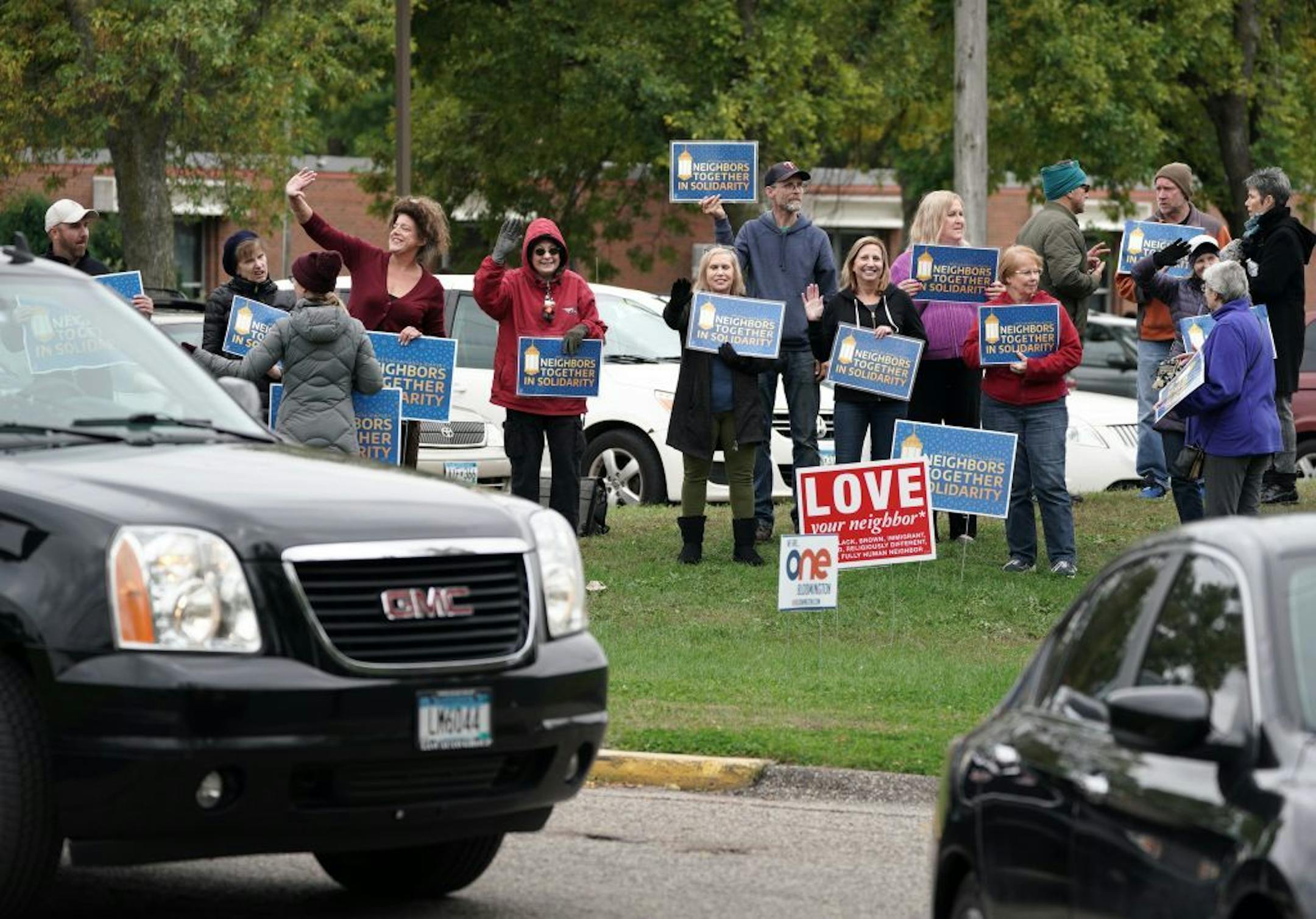 A group calling themselves Neighbors Together in Solidarity appears every Friday to show support for Dar al-Farooq Islamic Center in Bloomington, site of a 2017 bombing. The group has also noticed that as long as they show up, strangers toting video and still cameras tend to stay away.