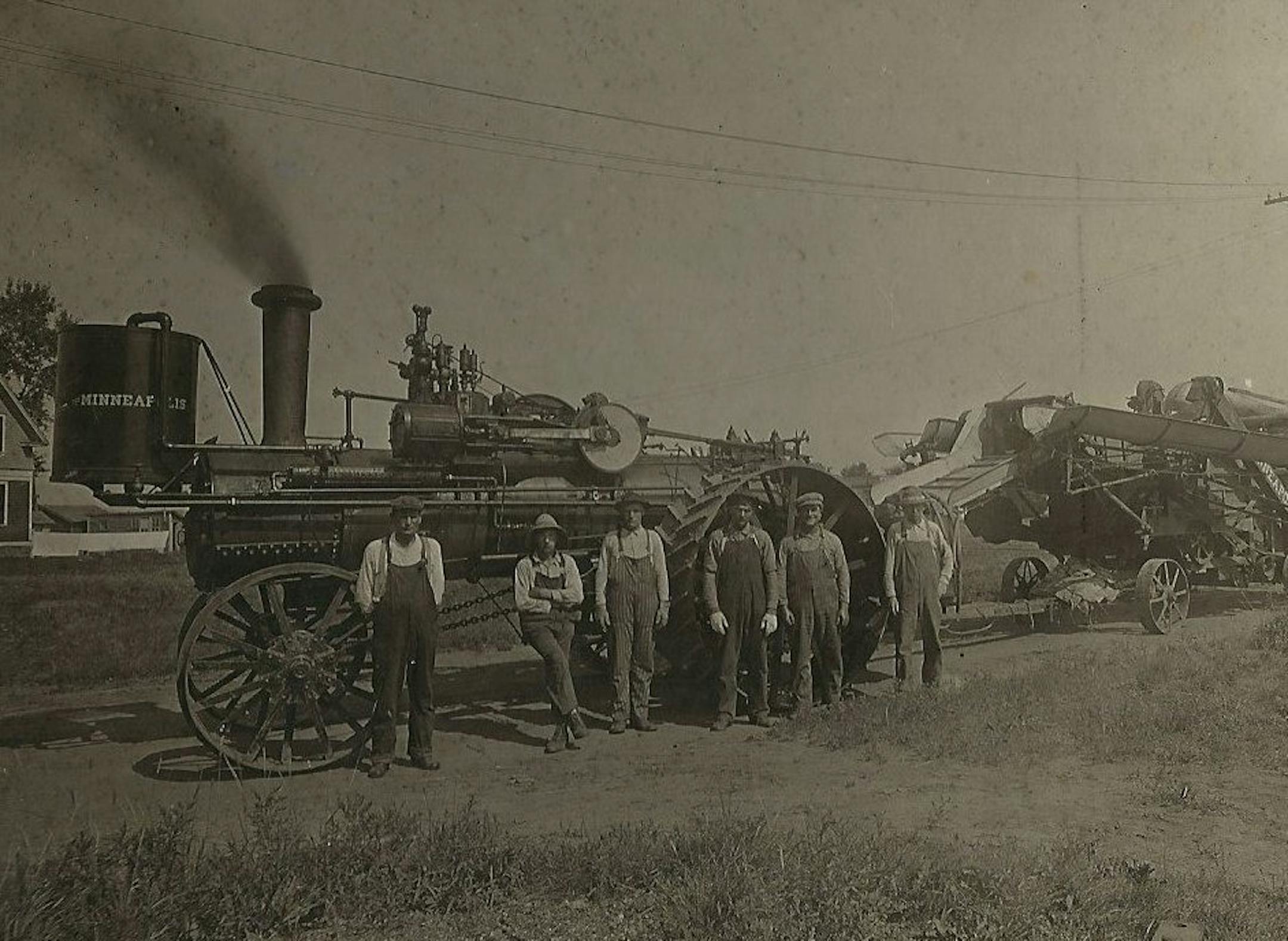 A threshing crew was ready to work at a farm.