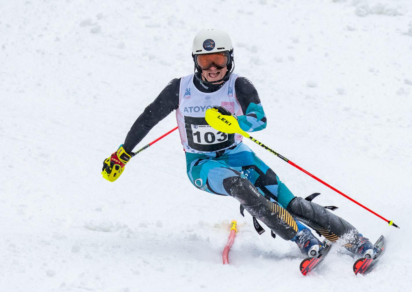 West Lutheran alpine skier Josh Nelson (103) passes through a gate in the second run of the MSHSL Boys and Girls Alpine Skiing State Meet Tuesday, Feb. 14, 2023 at Giant's Ridge in Biwabik, Minn. Nelson finished in first place with a combined run time of 1:14.33. ]