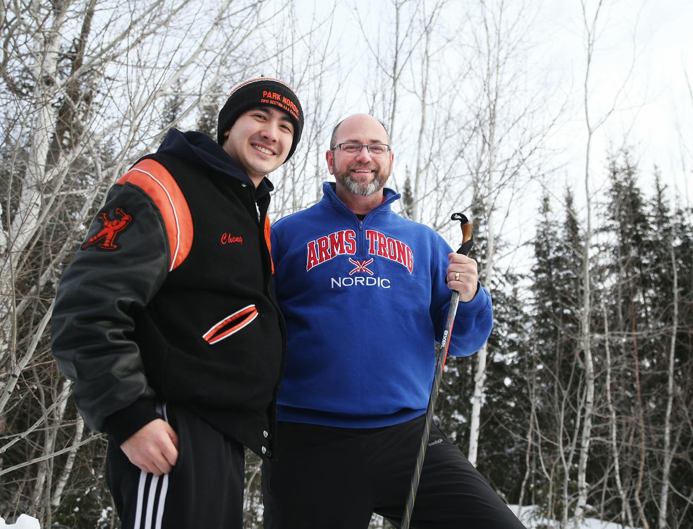 Armstrong High Nordic Ski coach Doug Hubred, right, was monitoring a tough turn on the sectional course when Ben Chong, a senior from St. Louis Park came by and broke a pole on the corner. Hubred then gave Chong a pole and Chong and his St. Louis Park teammates went on to win the sectional on Feb. 1 at Theodore Wirth Park, edging out Armstrong. "My son (Clayton) just missed out on it all," Hubred said. Chong and Hubred were seen during the boys' and girls' Nordic Ski State Meet Thursday, Feb. 11