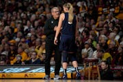 Paige Bueckers and coach Geno Auriemma talked during the first half of Sunday’s game.