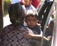 A child from Honduras is brought to the United States Immigration and Customs Enforcement office in Grand Rapids, Mich., Tuesday, July 10, 2018. Two b