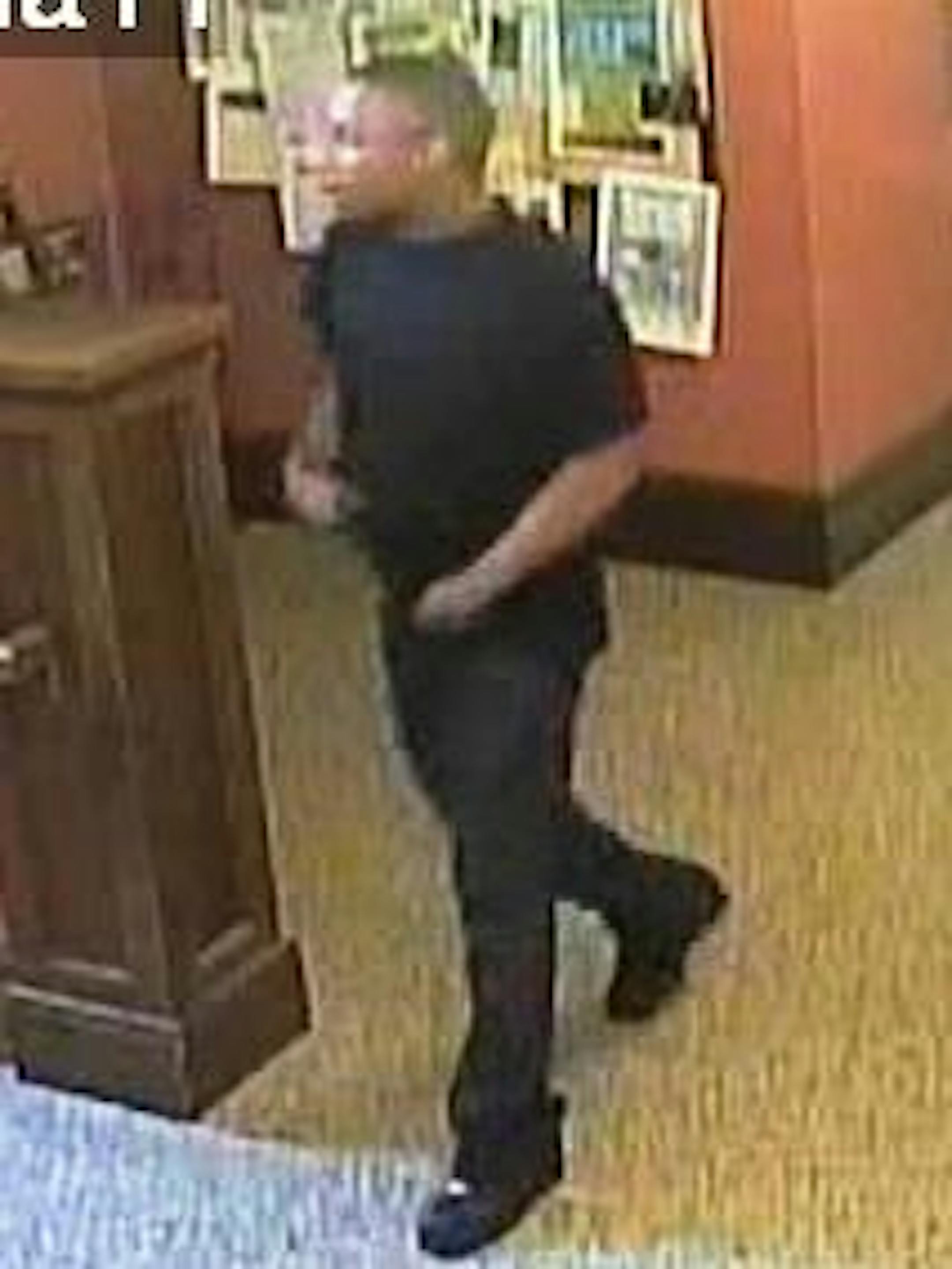 Police are seeking help in identifying this man, suspected of shooting a library patron in the back.