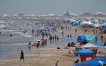 Visitors crowd the beaches, Saturday, July 6, 2024, in Port Aransas, Texas, ahead of Hurricane Beryl.