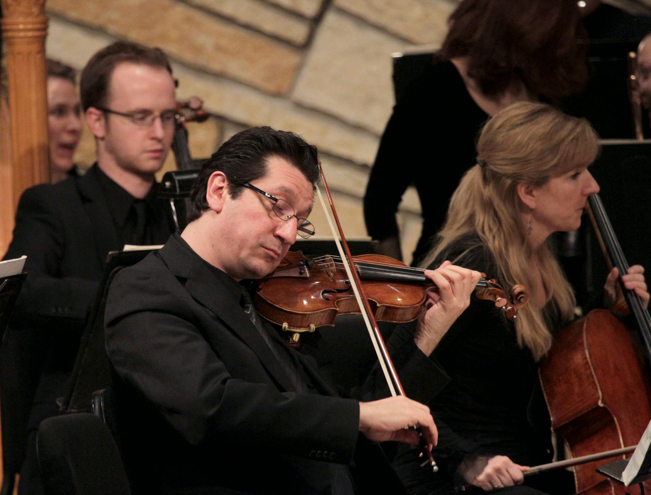 Ruggero Allifranchini, associate concertmaster of the St. Paul Chamber Orchestra, plays at a concert held at Trinity Lutheran Church in Stillwater, Minn.