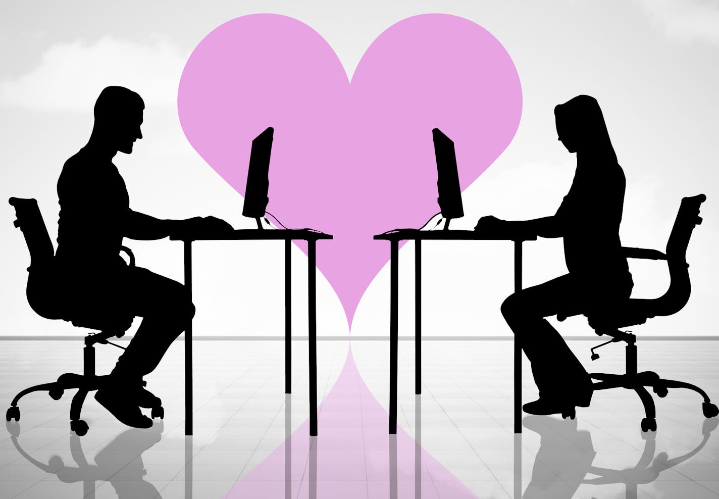 Silhouette Of Couple In Love Using Computers