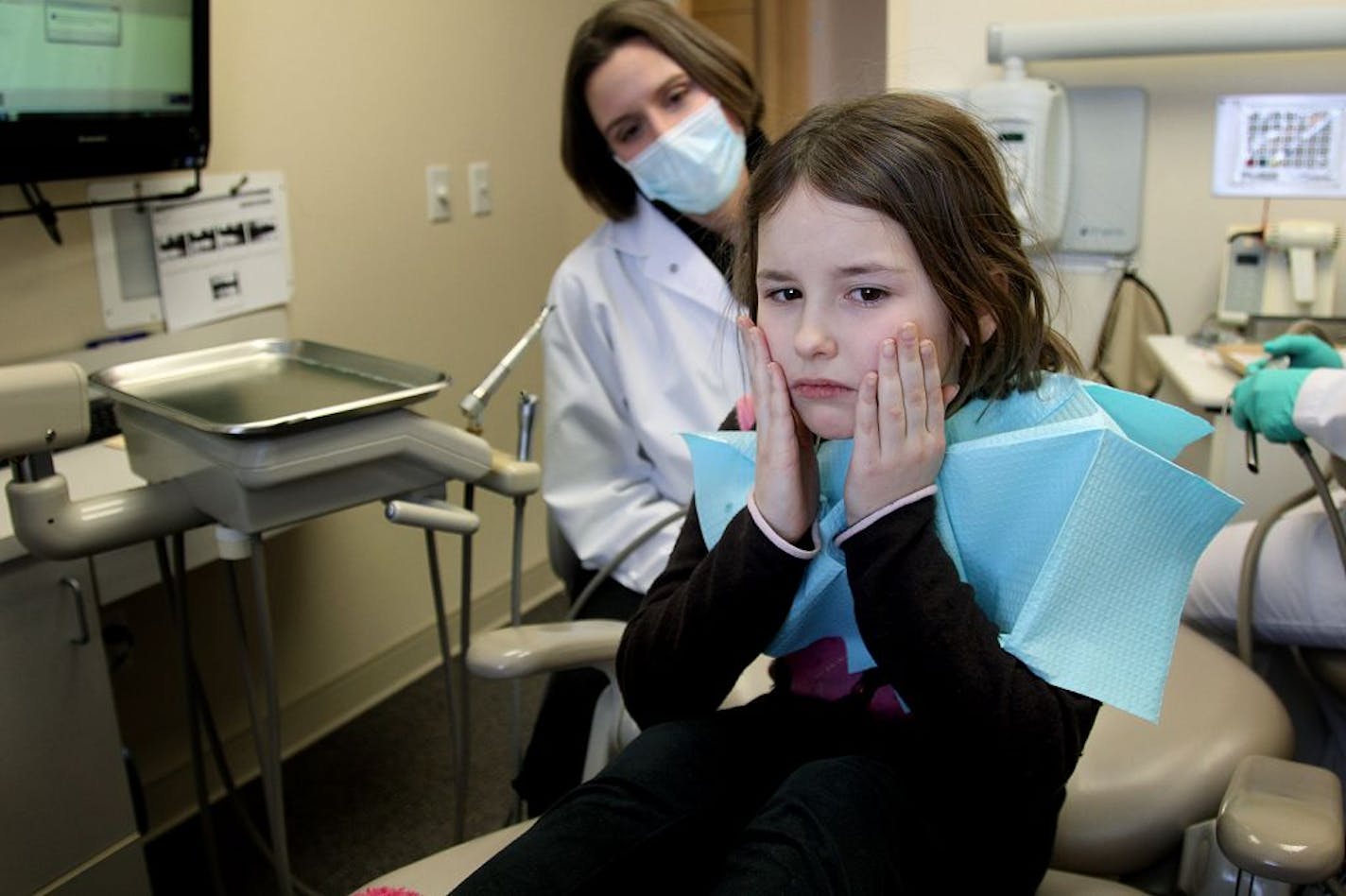 Dental patient Morgan Landberg, 9, reacted to novocaine as Park Dental Dentist Sarah L. Hermanson, DDS, worked on her at the Eden Prairie Park Dental office, Friday, February 1, 2013. (ELIZABETH FLORES/STAR TRIBUNE) ELIZABETH FLORES � eflores@startribune.com